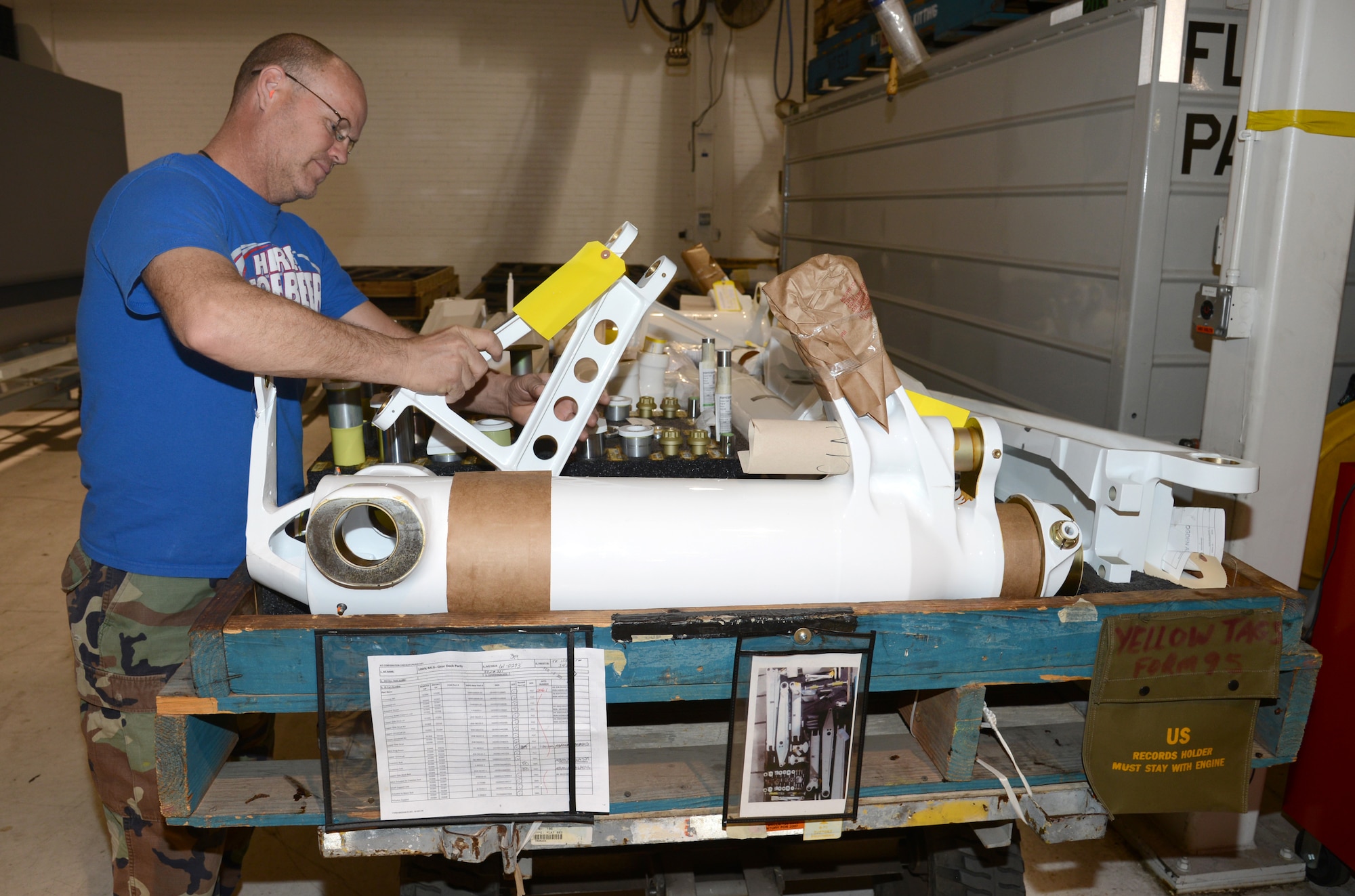 Robert McCoy, an aircraft mechanic with the 564th Aircraft Maintenance Squadron, puts a landing gear kit together to make sure that the mechanics in the Inspection Dock will have everything they need to install on the aircraft. (Air Force photo by Kelly White)