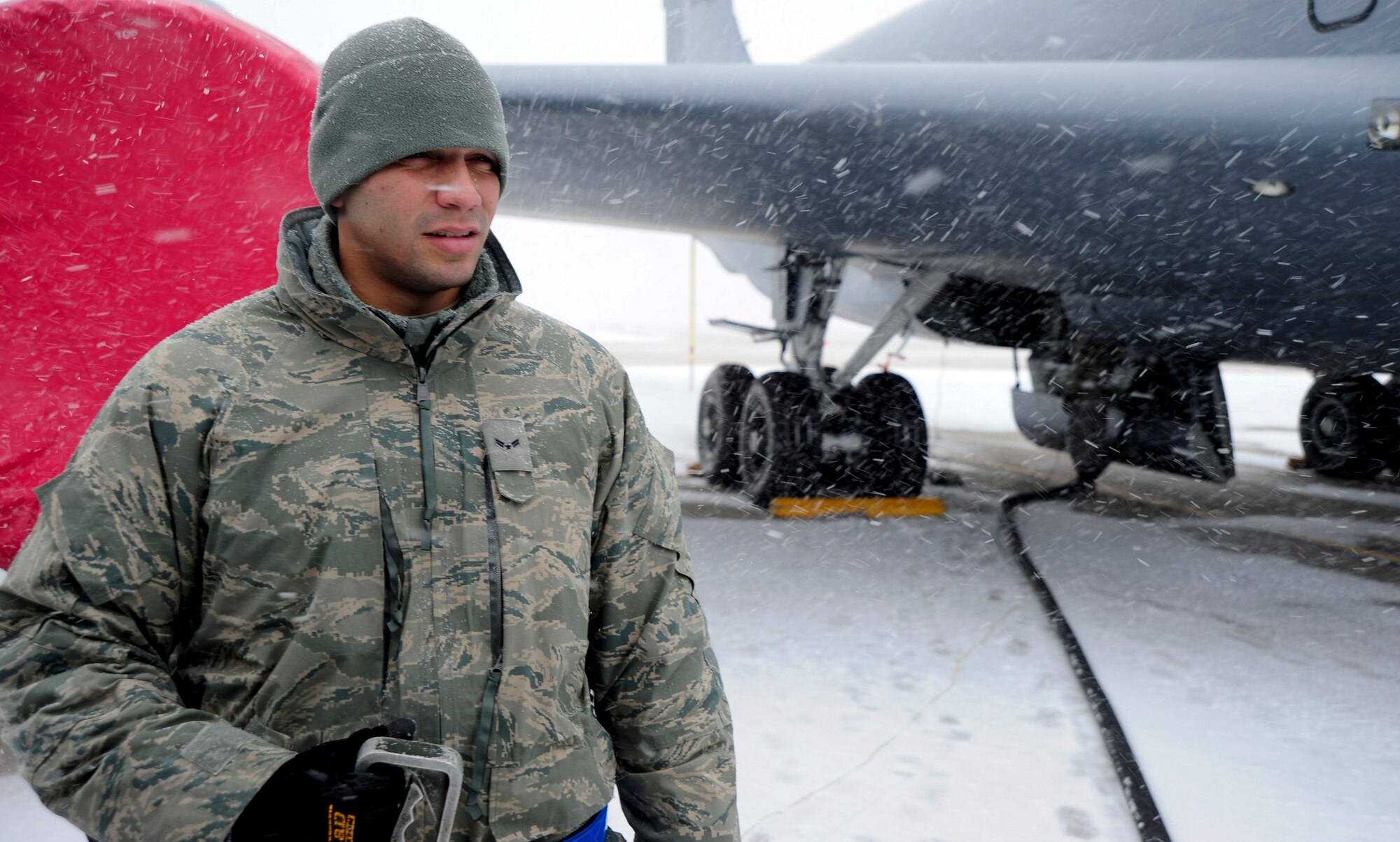 Airman 1st Class Jesus Cintron, 22nd Logistics Readiness Squadron fuels distribution technician, prepares to fuel a KC-135 Stratotanker Feb. 20, 2013, McConnell Air Force Base, Kan. Cintron was chosen as the spotlight performer due to his ability to demonstrate the wing commanders intents. (U.S. Air Force photo/Senior Airman Armando A. Schwier-Morales)