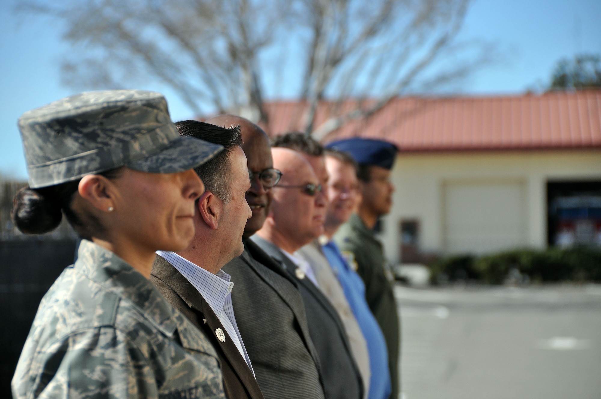 Tech Sgt. Marivel Rodriguez Regalado, Airman Leadership School instructor, teaches the flight of honorary commanders how to “dress right dress” Feb. 21 during the honorary commander boot camp, in order to create a uniform flight. (U.S. Air Force photo/Airman 1st Class Madelyn Brown).