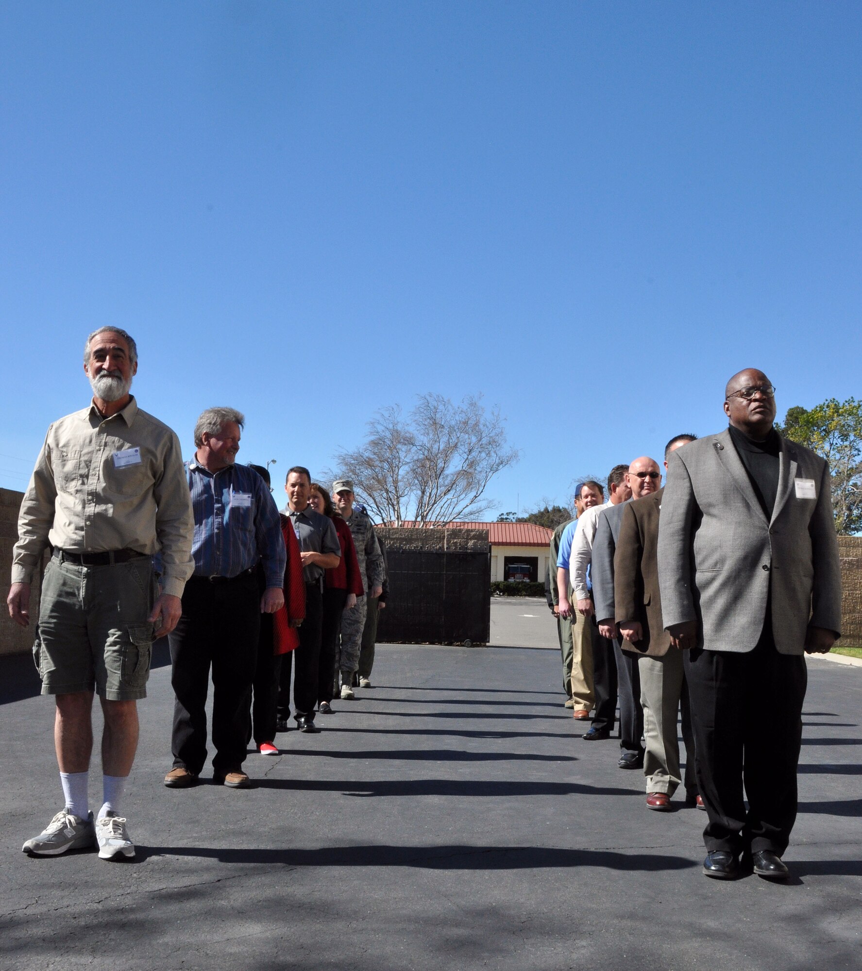 Honorary commanders practice facing movements in a flight prior to beginning the flag ceremony Feb. 21 during the honorary commander boot camp at the Airman Leadership School on Travis. (U.S. Air Force photo/Airman 1st Class Madelyn Brown).