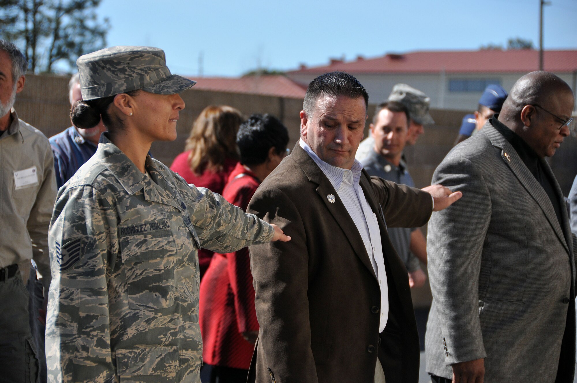 Tech Sgt. Marivel Rodriguez Regalado, Airman Leadership School instructor, teaches the flight of honorary commanders how to “dress right dress” Feb. 21 during the honorary commander boot camp, in order to create a uniform flight. (U.S. Air Force photo/Airman 1st Class Madelyn Brown).