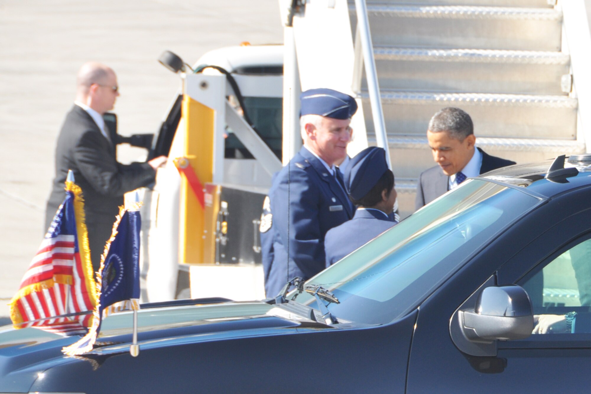 Col. Steven R. Clayton, 94th Operations Group commander and Senior Airman Tumyra D. Byron, knowledge management specialist, greet President Barack Obama during his visit to Dobbins Air Reserve Base, Feb. 14. The president was en-route to the City of Decatur Recreation Center to discuss proposals outlined in his recent state of the union address. Bryon received a President’s Coin from Obama during the visit. (U.S.Air Force photo/James Branch)