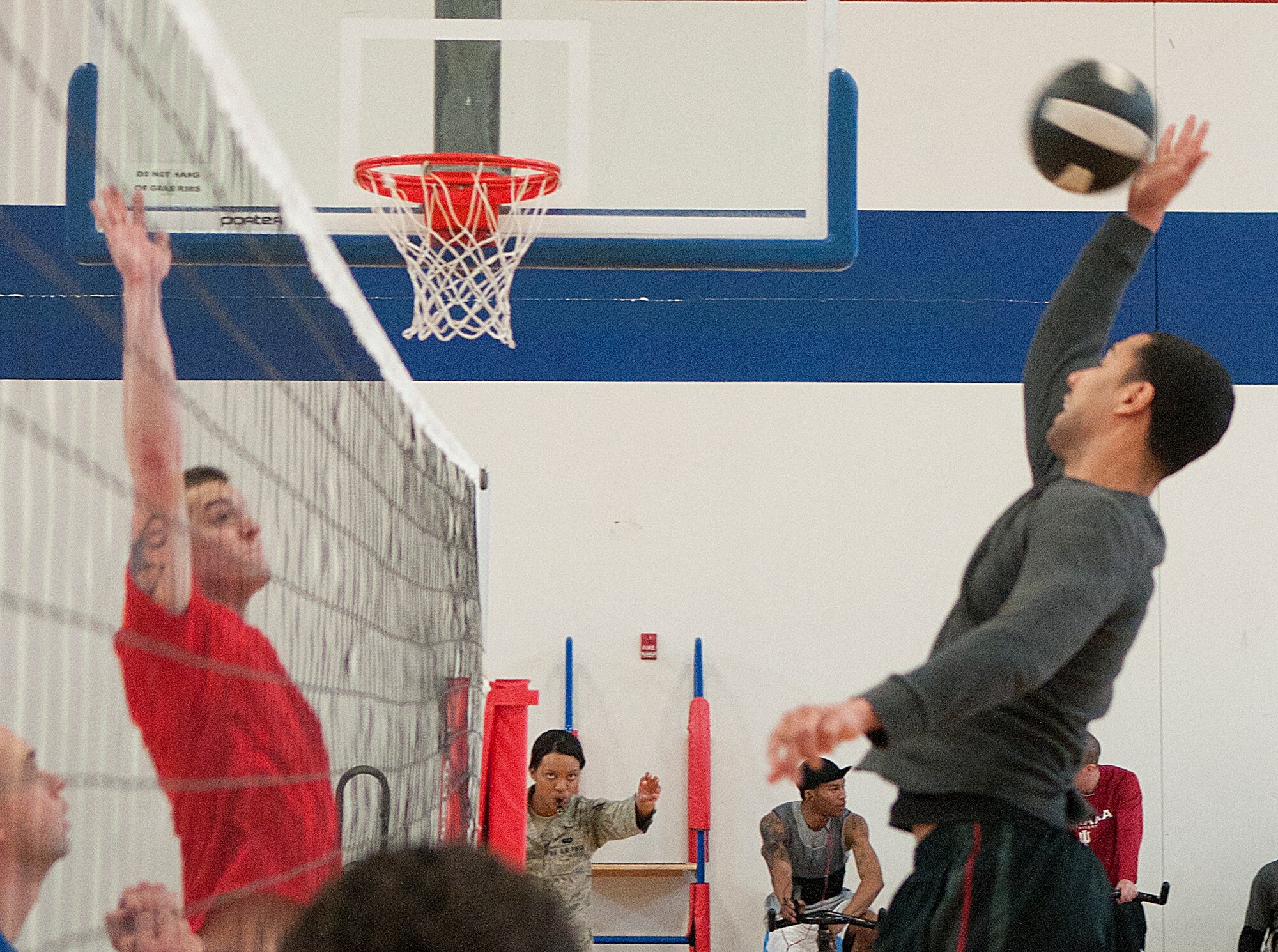 The 90th Missile Maintenance Group’s Corey Rucker smacks the ball against 90th Comptroller Squadron’s Cameron Geiger during a volleyball tournament at Freedom Hall Fitness Center on F. E. Warren Air Force Base Feb. 23. (U.S. Air Force photo by R.J. Oriez)