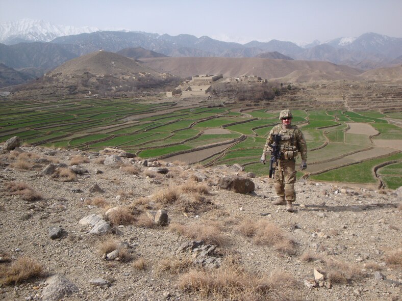Master Sgt. Christopher Irving, 90th Logistics Readiness Squadron, looks out on a village in the Nahgarhar Province, Afghanistan, during a mounted combat patrol to the Tora Bora Mountain Range in support of U.S. Agency for International Development flood control projects. Irving was deployed for a total of 421 days, including pre-deployment training and three days at the deployment transition center. (Courtesy photo)