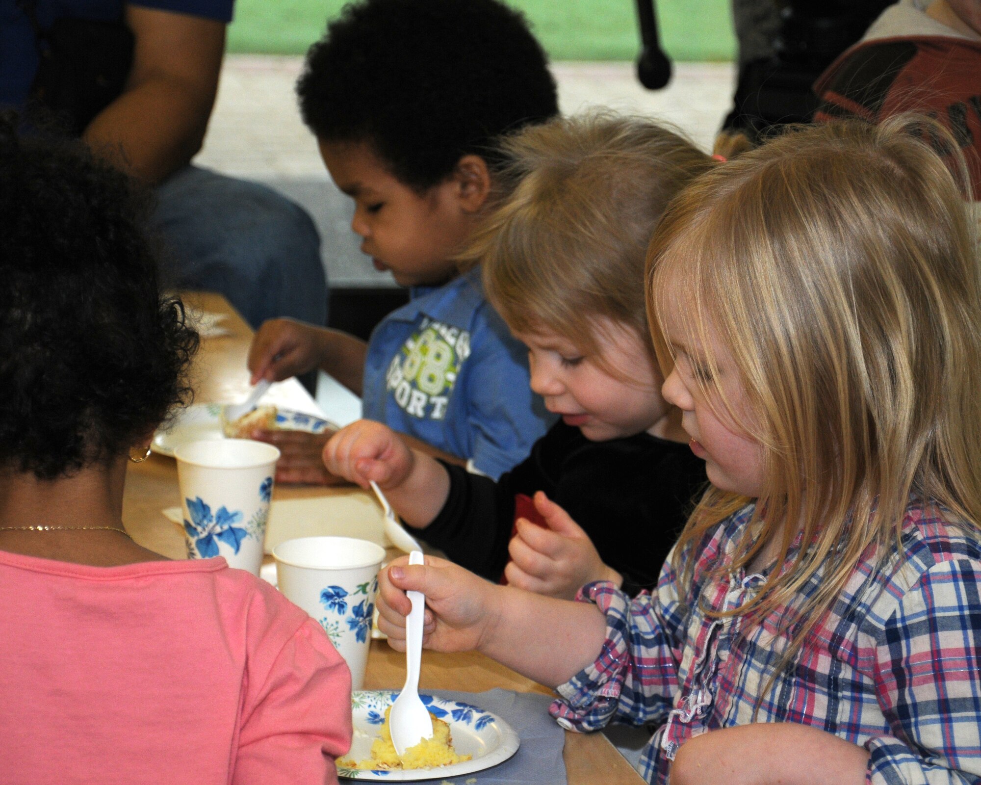 Children enjoy cake to celebrate the birthday of Dr. Seuss March 1, 2013, at the child development center on RAF Mildenhall, England. March 1 is Read Across America Day, which is a nationwide observance coinciding with the birthday of Dr. Seuss Geisel, the author of many popular children's books. In 1997, the National Education Association pushed for a special day to celebrate reading throughout the United States. This idea proved to be a popular one; the first Read Across America Day was held March 2, 1998. (U.S. Air Force photo by Gina Randall/Released)
