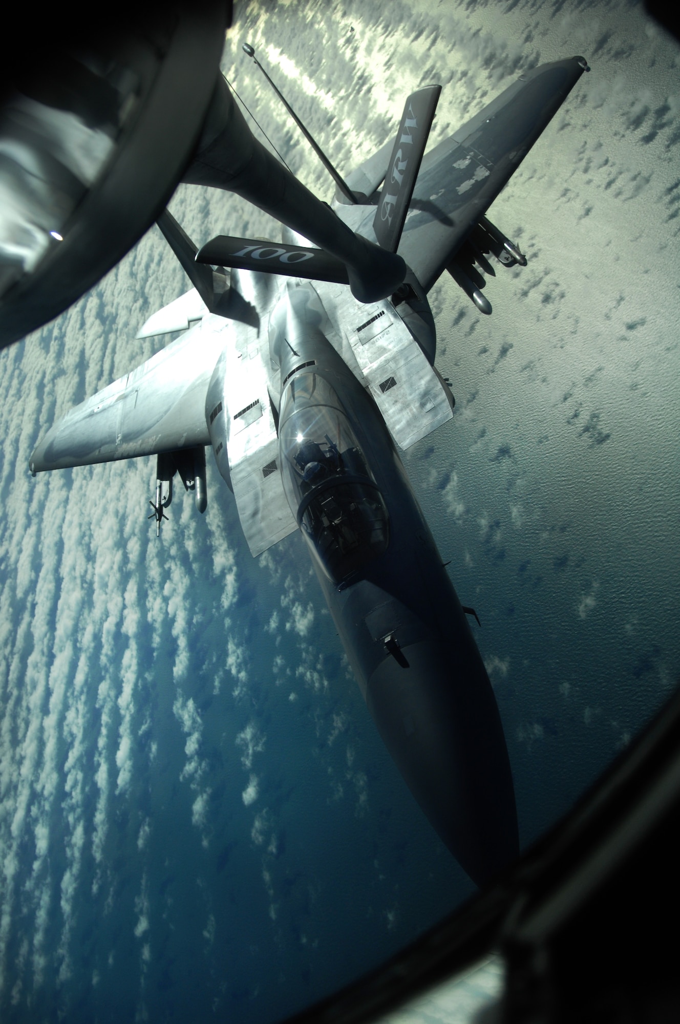 An F-15C Eagle from RAF Lakenheath, England, receives fuel from a KC-135R Stratotanker, from RAF Mildenhall, England, during a refueling exercise Feb. 27, 2013, over the northern coast of Norfolk, England. Refueling exercises keep pilots and boom operators prepared to perform their job in a real-world operation. (U.S. Air Force photo by Airman 1st Class Dillon Johnston/Released)