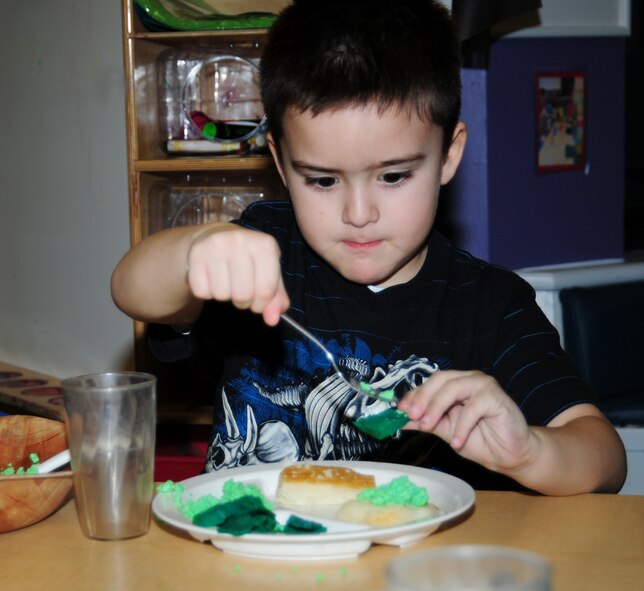 Triston Manrique, 5, prepares to make a sandwich with his green eggs and ham at the Dr. Seuss breakfast March 1, 2013 at the 100th Force Support Squadron Child Development Center, RAF Mildenhall, England. March 1 is Read Across America Day, which is a nationwide observance coinciding with the birthday of Dr. Seuss Geisel, the author of many popular children's books.  In 1997, the National Education Association pushed for a special day to celebrate reading throughout the United States. This idea proved to be a popular one; the first Read Across America Day was held March 2, 1998. (U.S. Air Force photo by Karen Abeyasekere/Released)