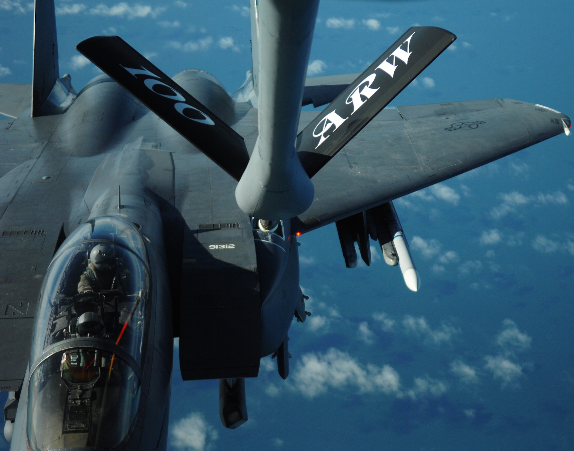 An F-15E Strike Eagle from RAF Lakenheath, England, receives fuel from a KC-135R Stratotanker, from RAF Mildenhall, England, Feb. 27, 2013, during a refueling exercise over the northern coast of Norfolk, England. Refueling exercises keep pilots and boom operators prepared to perform their job in a real-world operation. (U.S. Air Force photo by Airman 1st Class Dillon Johnston/Released)