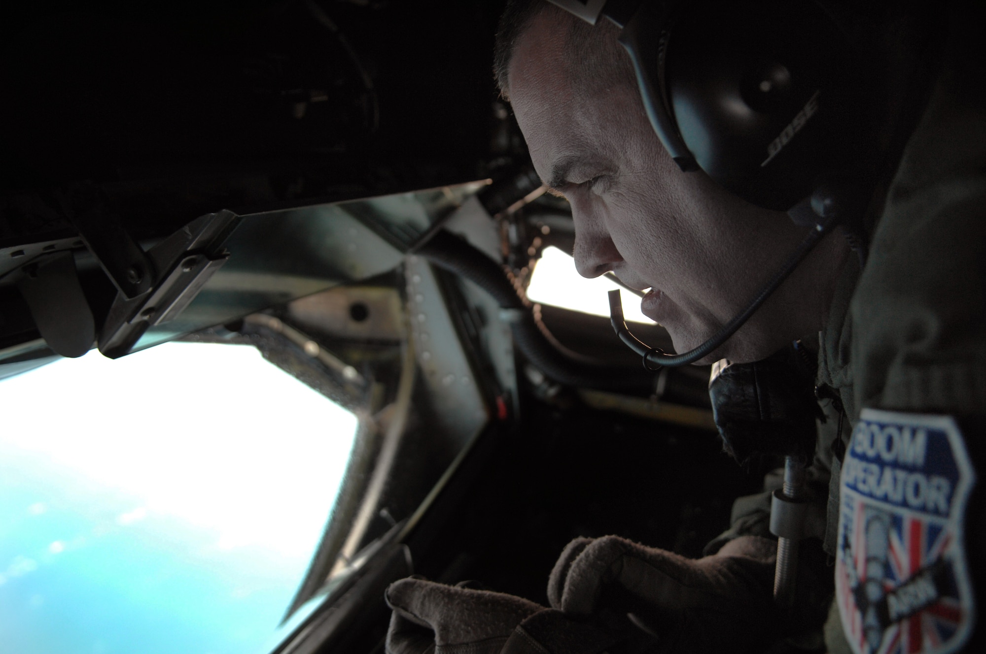Senior Master Sgt. Paul Wallace, 351st Air Refueling Squadron superintendent from Ottumwa, Iowa, prepares to operate the boom on a KC-135R Stratotanker aircraft from RAF Mildenhall, England, during a refueling exercise Feb. 27, 2013, over the northern coast of Norfolk, England. The KC-135R refueled F-15C Eagle and F-15E Strike Eagle aircraft from RAF Lakenheath, England, during the exercise. (U.S. Air Force photo by Airman 1st Class Dillon Johnston/Released)