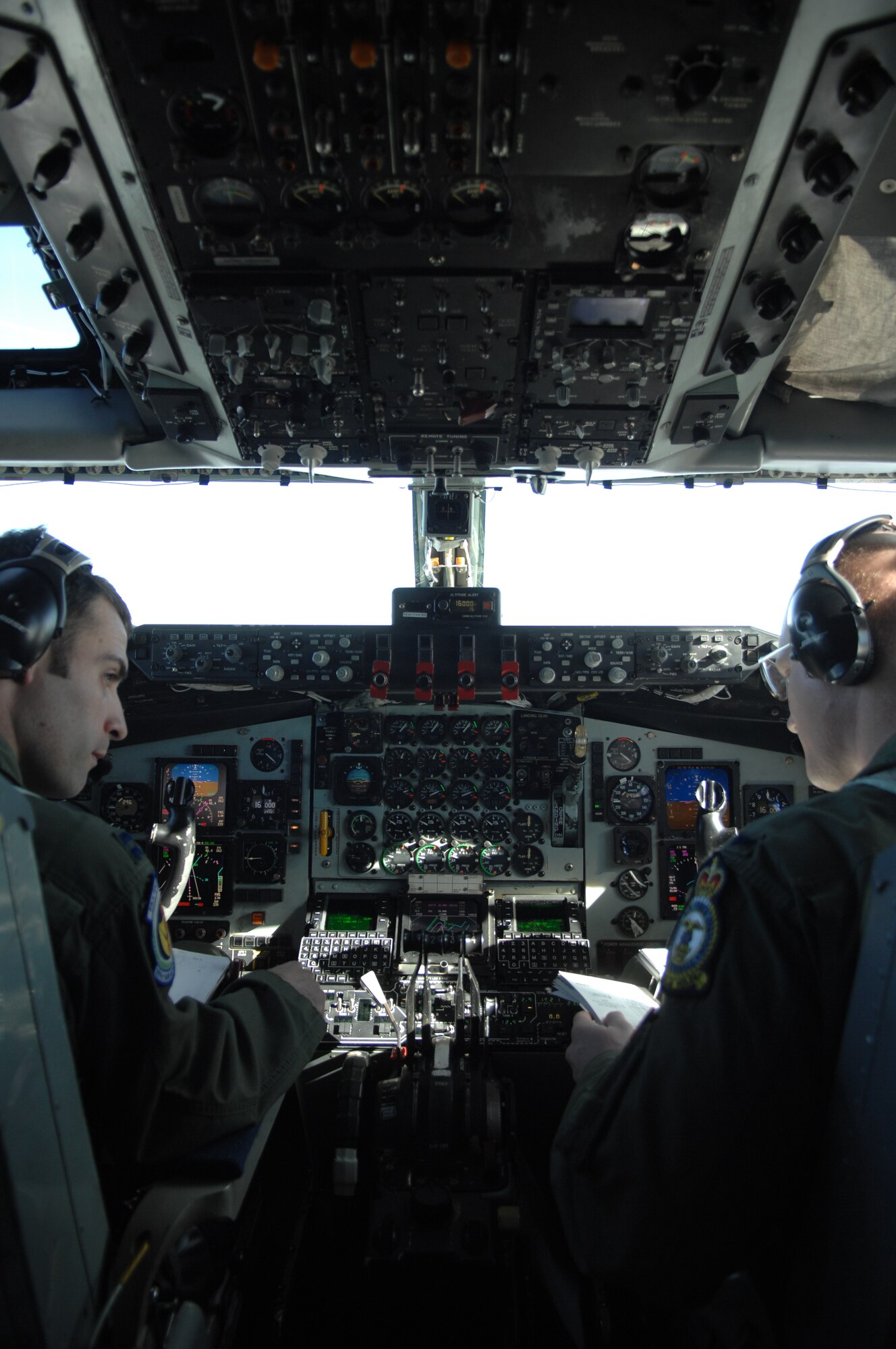 From left, Capt. Jonathan Bourke, 351st Air Refueling Squadron KC-135R Stratotanker aircraft commander from Milwaukee, and 1st Lt. Samuel Holbrook, 351st ARS KC-135R co-pilot from Missouri, fly a KC-135R Feb. 27, 2013, during a refueling exercise over the northern coast of Norfolk, England. The KC-135R refueled F-15C Eagle and F-15E Strike Eagle aircraft from RAF Lakenheath, England, during the exercise. (U.S. Air Force photo by Airman 1st Class Dillon Johnston/Released)