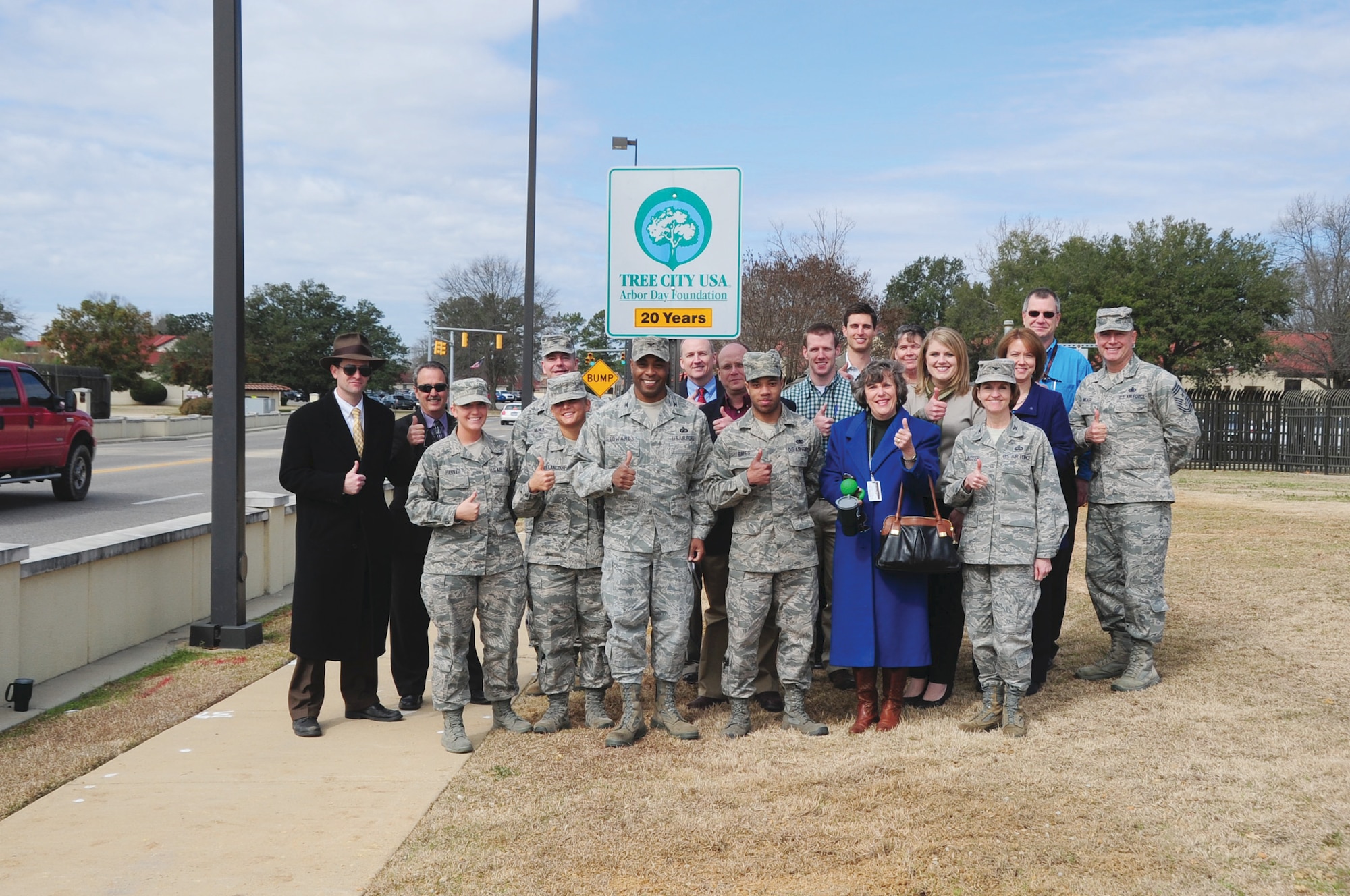 In celebration of Maxwell's 20th consecutive Tree City USA award, base and city leadership, volunteers and visitors taking part in the Arbor Day event witnessed the replacement of the Tree City USA marker by the Bell Street gate's visitor center. (U.S. Air Force photo by Staff Sgt. Sandra Percival)
