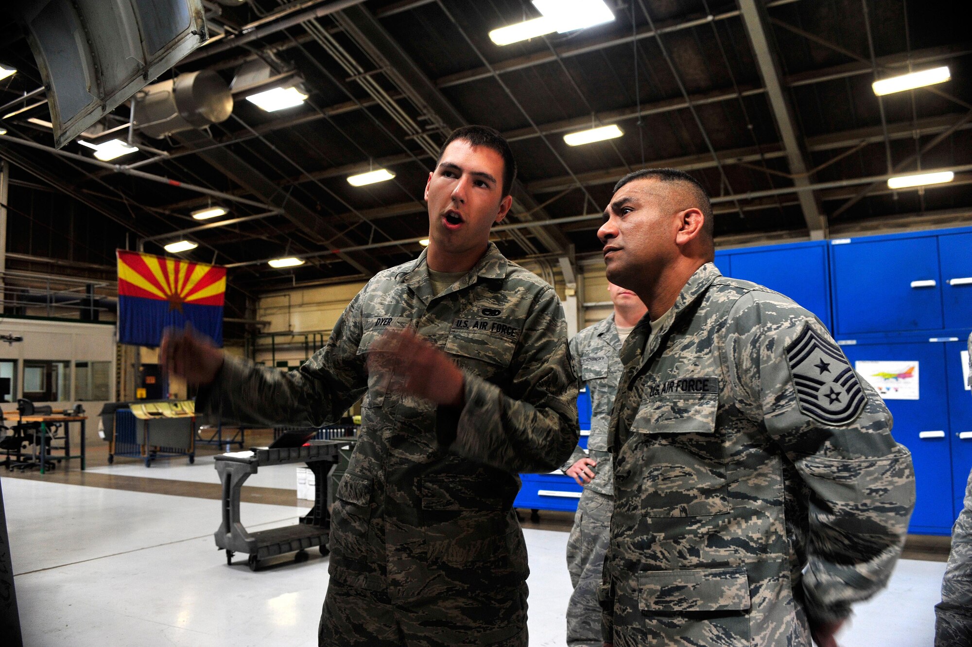 Senior Airman Shawn Dyer, 56th Equipment Maintenance Squadron Maintenance Flight crew chief, briefs Chief Master Sgt. Gerardo Tapia, Air Education and Training Command chief, Feb. 22 when the chief visited Luke Air Force Base. (U.S. Air Force photo/Staff Sgt. Jason Colbert)
