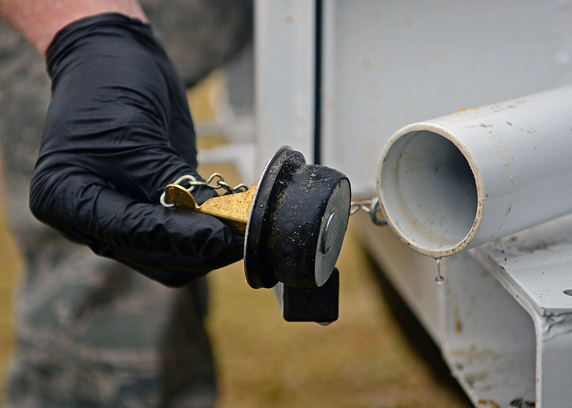 Senior Airman Benjamin Krage, 31st Civil Engineer Squadron water and fuel systems maintenance journeyman, plugs a Trav-L-Vac 300 after empting human waste Feb. 14, 2013, at Aviano Air Base, Italy. The 31st Civil Engineer Squadron water and fuel systems maintenance crew are responsible for more than 40 septic tanks and grease traps located on the base. (U.S. Air Force photo/Airman 1st Class Matthew Lotz)