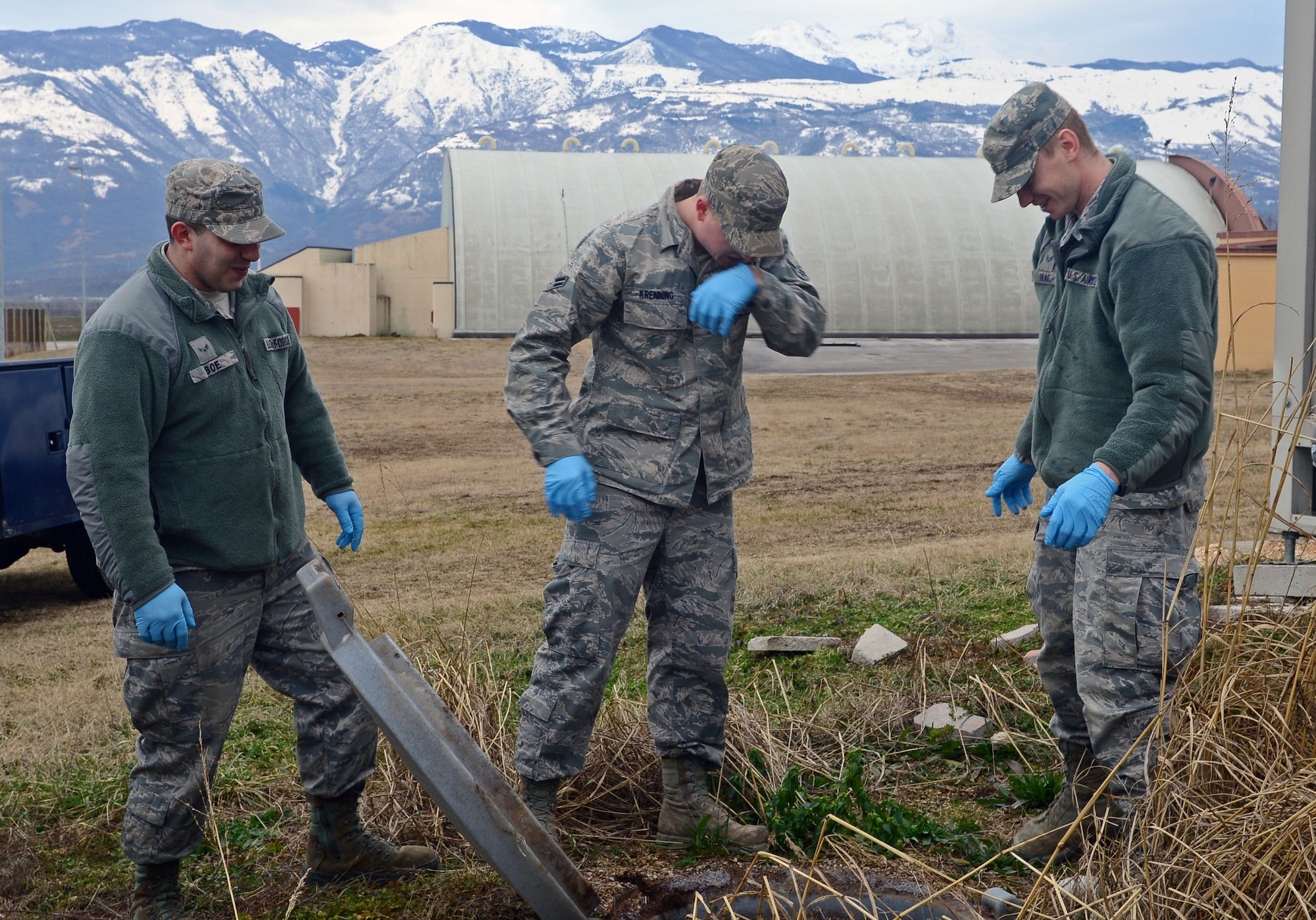 Airmen from the 31st Civil Engineer Squadron water and fuel systems maintenance crew, examine a septic tank Feb. 14, 2013, at Aviano Air Base, Italy. Once a week, at least two crew members provide upkeep on the septic tanks or grease traps that need to be emptied. (U.S. Air Force photo/Airman 1st Class Matthew Lotz)