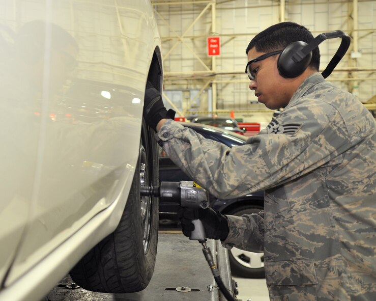 Senior Airman Rodel Lalap, 100th Logistics Readiness Squadron general purpose vehicle mechanic from Long Beach, Calif., removes lug nuts to replace a tire Feb. 28, 2013, at RAF Mildenhall, England. The 100th LRS Vehicle Management Flight maintains a total of 574 government vehicles assigned to the base. (U.S. Air Force photo by Senior Airman Jerilyn Quintanilla/Released) 