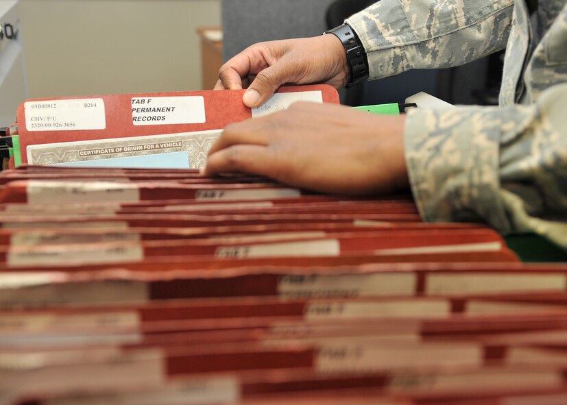Senior Airman Kimberly Lewis, 100th Logistics Readiness maintenance controller from Camden, Ark., reviews vehicle records Feb. 28, 2013, at RAF Mildenhall, England. The 100th LRS Vehicle Maintenance Flight is responsible for maintaining records for all vehicles in the base inventory. (U.S. Air Force photo by Senior Airman Jerilyn Quintanilla/Released)
