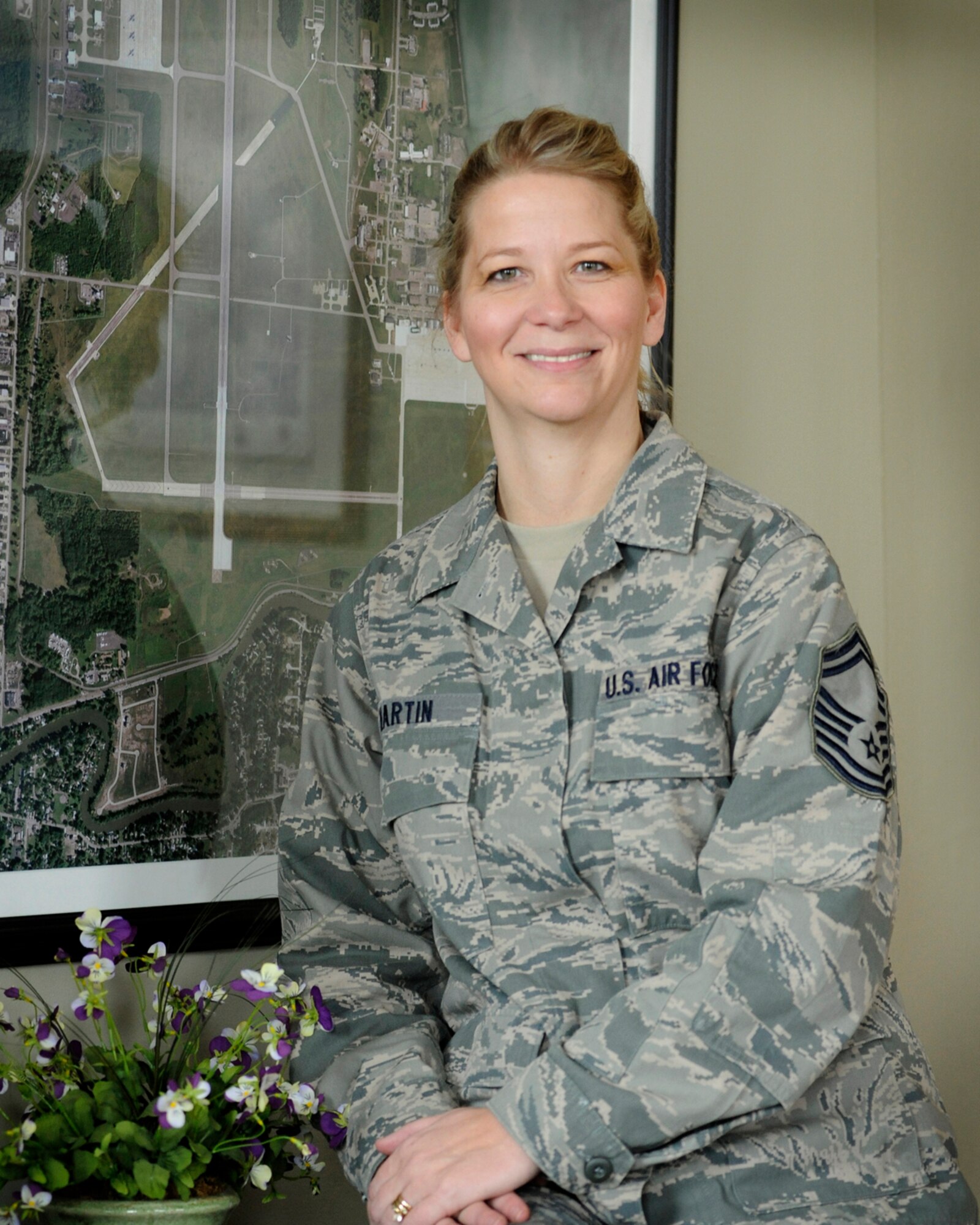 SMSgt. Kelli Martin is seen in her office in the Base Operations building at Selfridge Air National Guard Base, Mich., Feb. 20, 2013. Martin was recently named the airfield manager of the year by the Air National Guard. In each of the previous two years, she was part of a team that won airfield complex of the year honors from the ANG. (Air National Guard photo by John S. Swanson)