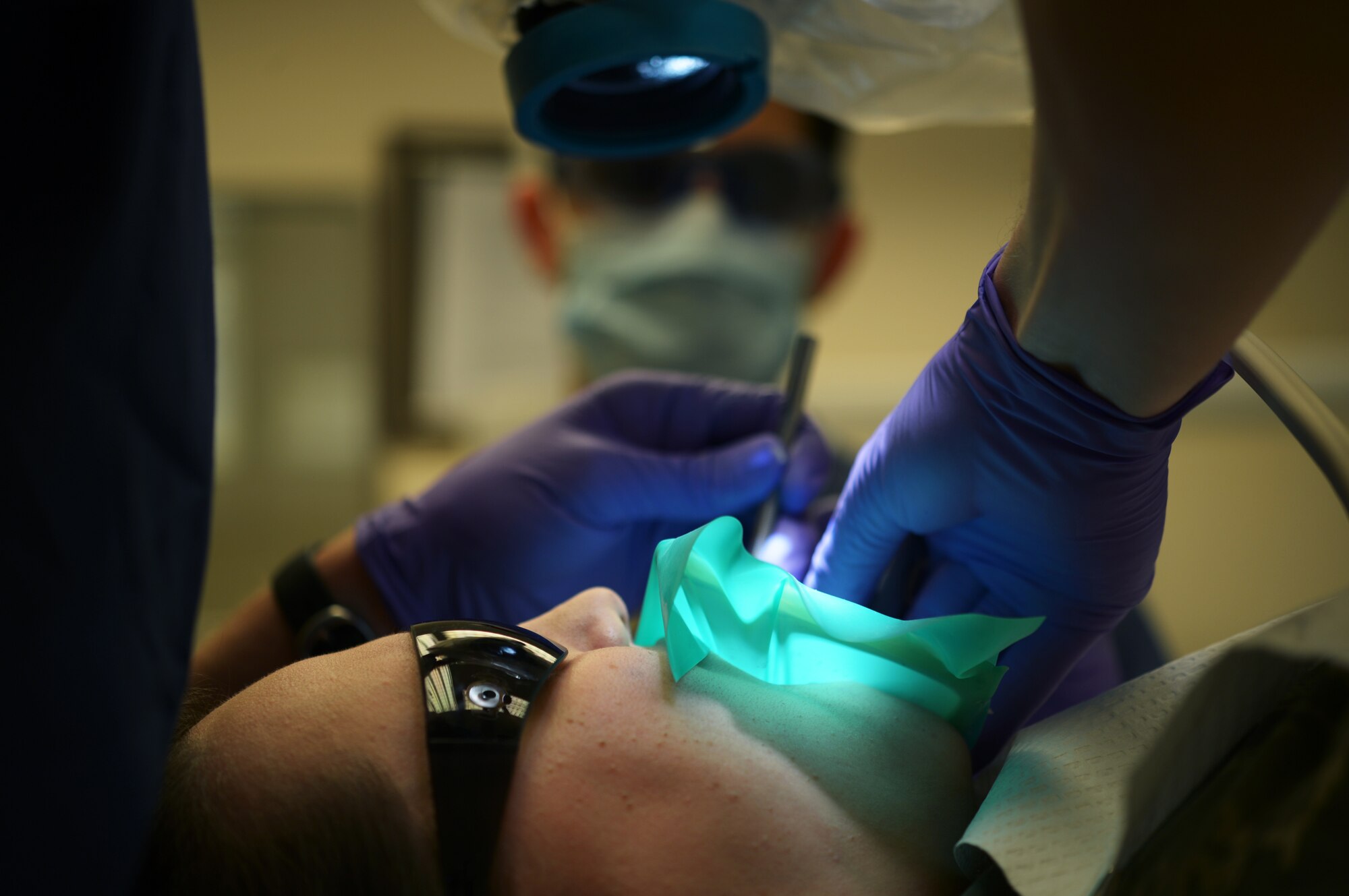 ROYAL AIR FORCE LAKENHEATH, England - Maj. (Dr.) Nick Schulte, 48th Dental squadron chief of endodontics, performs a root canal Feb. 27, 2013. Root canal treatment addresses diseases of the pulpal tissue inside the tooth and roots. (U.S. Air Force photo by Senior Airman Lausanne Morgan)