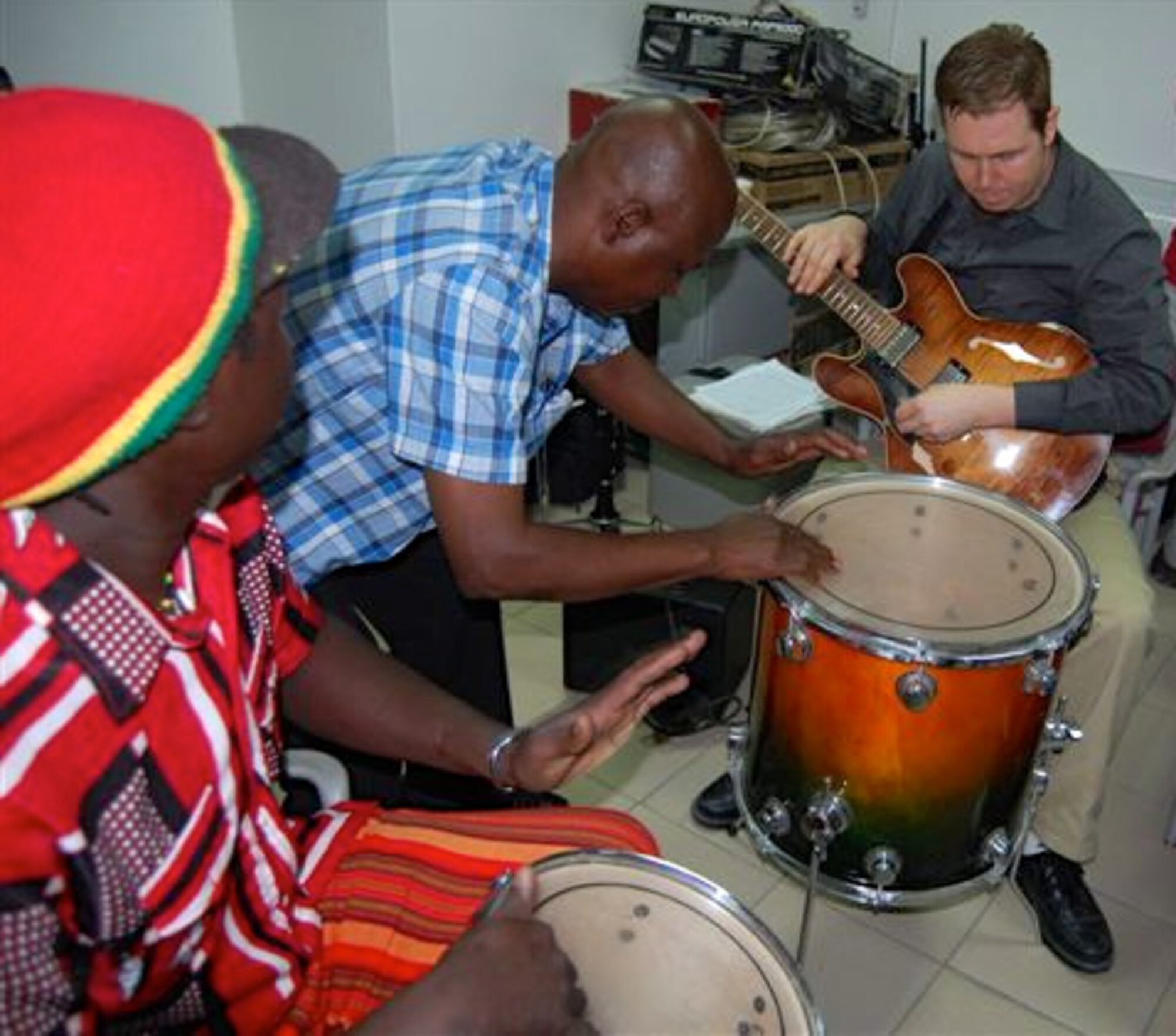 Staff Sgt. Joe Gacioch, a guitarist with the Wings of Dixie ensemble of the United States Air Forces in Europe-Air Forces Africa Band, participates in a jam session with Chadian musicians during a music workshop  at the U.S. Embassy in N’Djamena, Chad Feb. 23, 2013. The workshop was part of a weeklong visit to the African nation was part of USAFE-AFAFRICA’s Building Partnership Initiative. During the visit, the Band performed five concerts, which were attended by 850 people.  U.S. Air Force Courtesy Photo