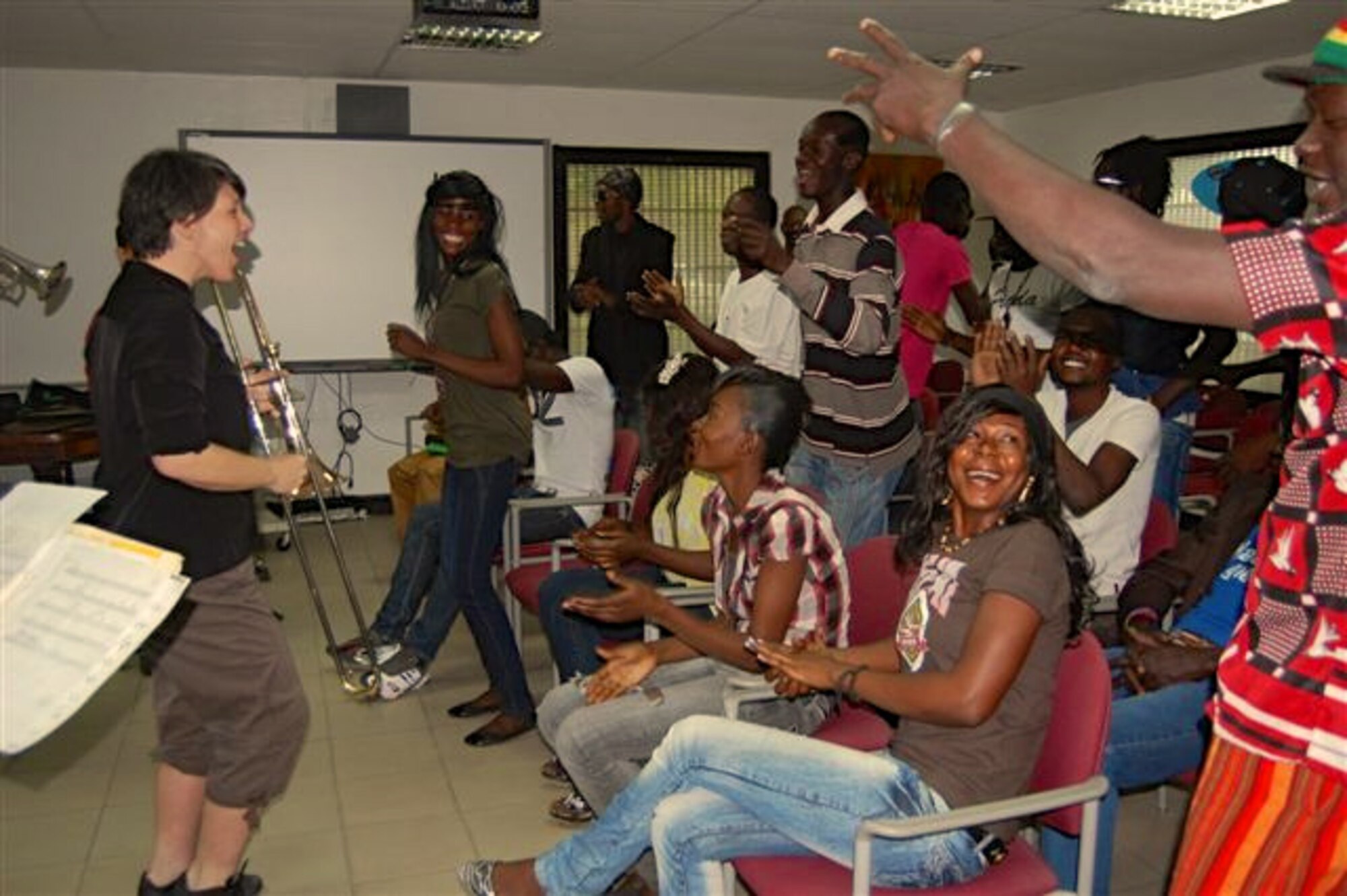 Staff Sgt. Saundra Sininger, a trombonist with the Wings of Dixie ensemble of the U.S. Air Forces in Europe-Air Forces Africa Band, pumps up the crowd during a music workshop at the U.S. Embassy in N’Djamena, Chad Feb. 23, 2013. The workshop, attended by nearly 40 Chadian musicians, was part of the Band’s visit to the African nation to support USAFE-AFAFRICA’s Building Partnership Initiative. The Band also performed five concerts to a total audience of 850 people.  U.S. Air Force Courtesy Photo