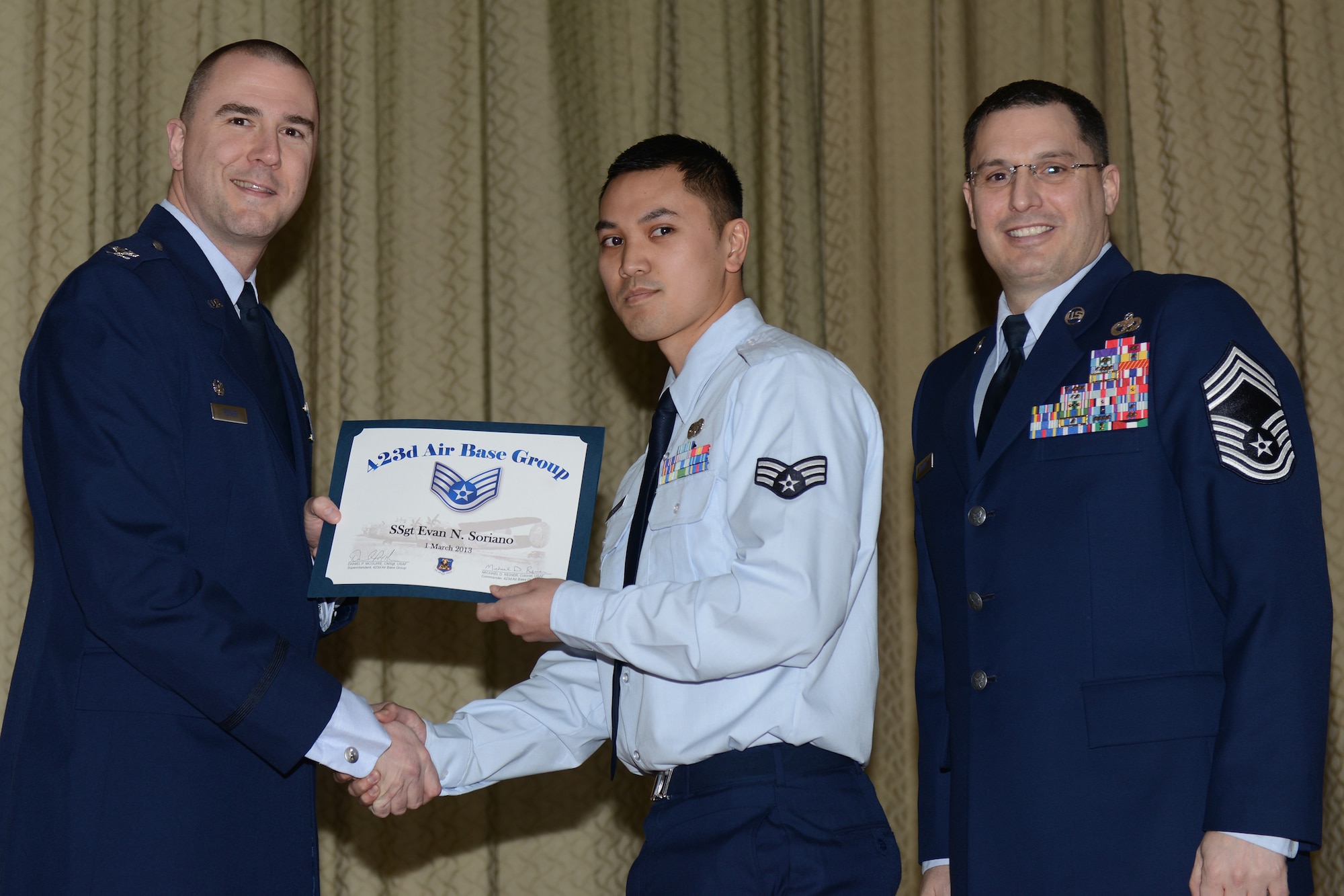 RAF ALCONBURY, United Kingdom – Staff Sgt. Evan Soriano, 423rd Communications Squadron, receives his certificate for promotion to staff sergeant Feb. 28 at the RAF Alconbury Theater. (U.S. Air Force photo by Tech. Sgt. Chrissy Best)