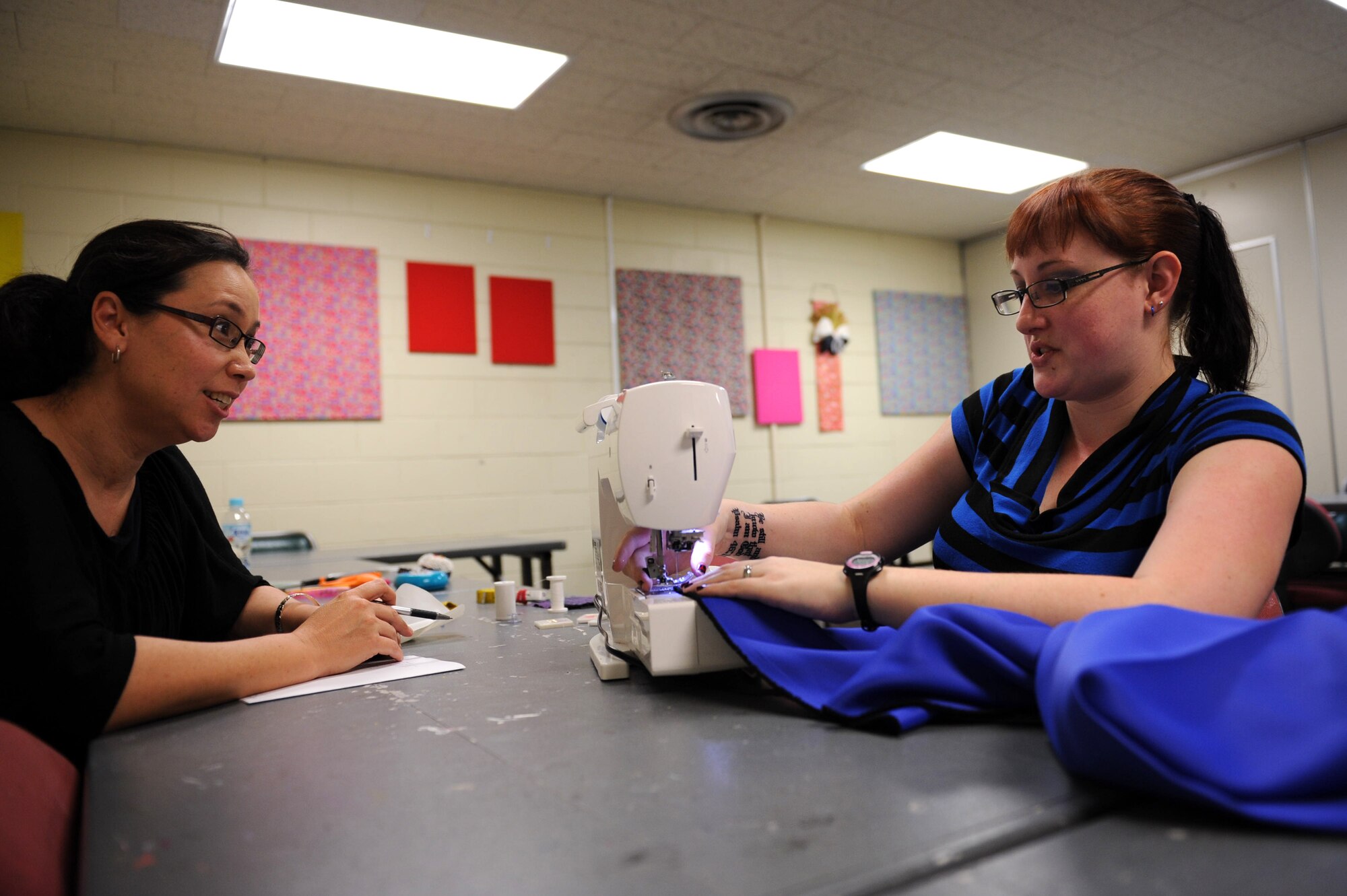 Meagan Todd, 18th Force Support Squadron Crafty Things sewing instructor, explains the importance of creating a seam on a piece of fabric to Chisako Oshiro during a sewing lesson on Kadena Air Base, Japan, March 1, 2013. The 18th FSS also won the Pacific Air Forces’ Arts and Crafts Program of the Year award for 2012. (U.S. Air Force photo/Airman 1st Class Hailey R. Davis)