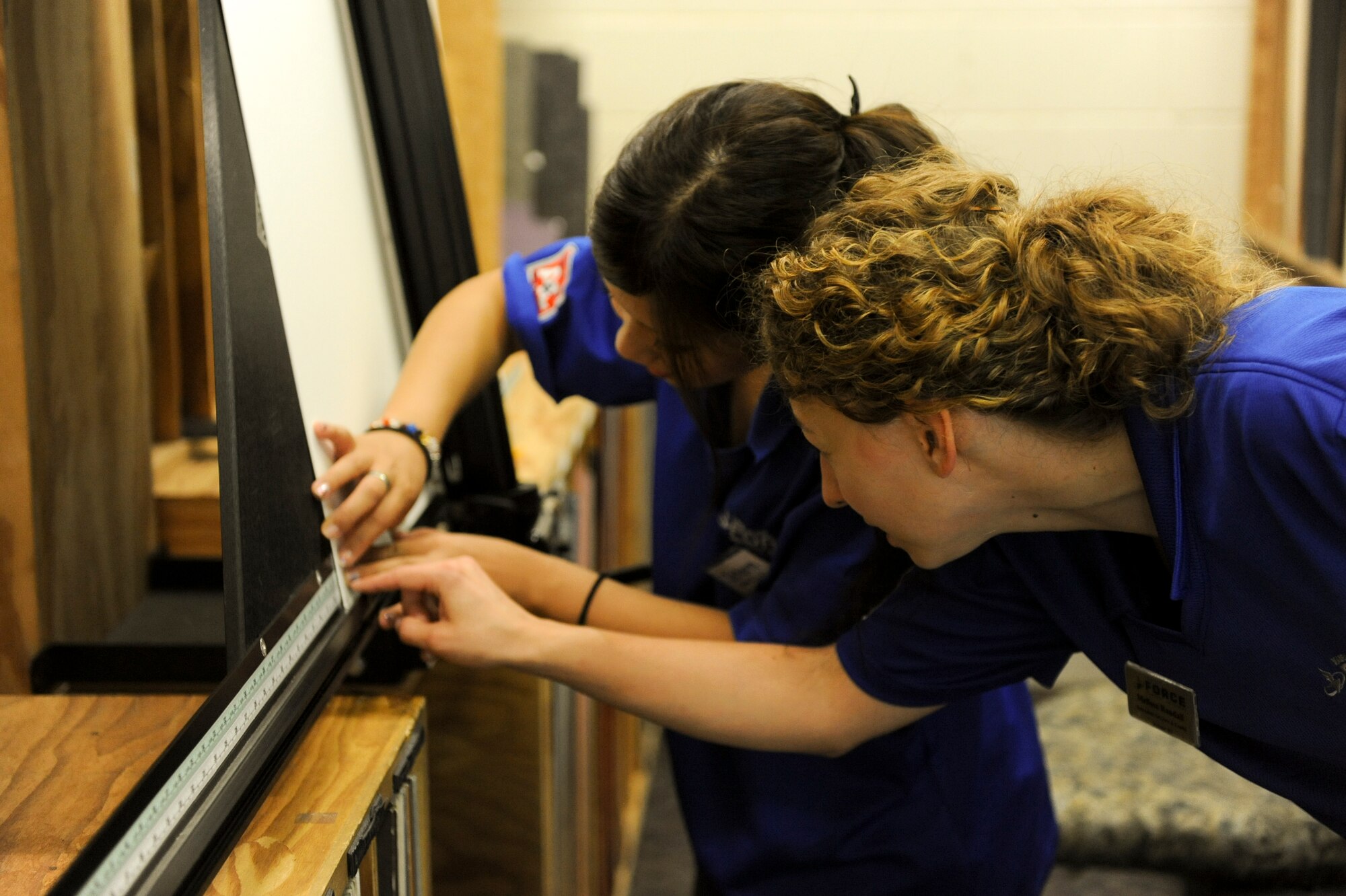 Yui Makawa, a Kadena Language Institute student, cuts out matting for a frame at Crafty Things on Kadena Air Base, Japan, Sept. 4, 2012. Crafty Things, an asset of the 18th Force Support Squadron,   offers arts and crafts classes such as woodworking, sewing and pottery making. The 18th FSS won the Pacific Air Forces Arts and Crafts Program of the Year award for 2012. (U.S. Air Force photo/Airman 1st Class Brooke P. Doyle)