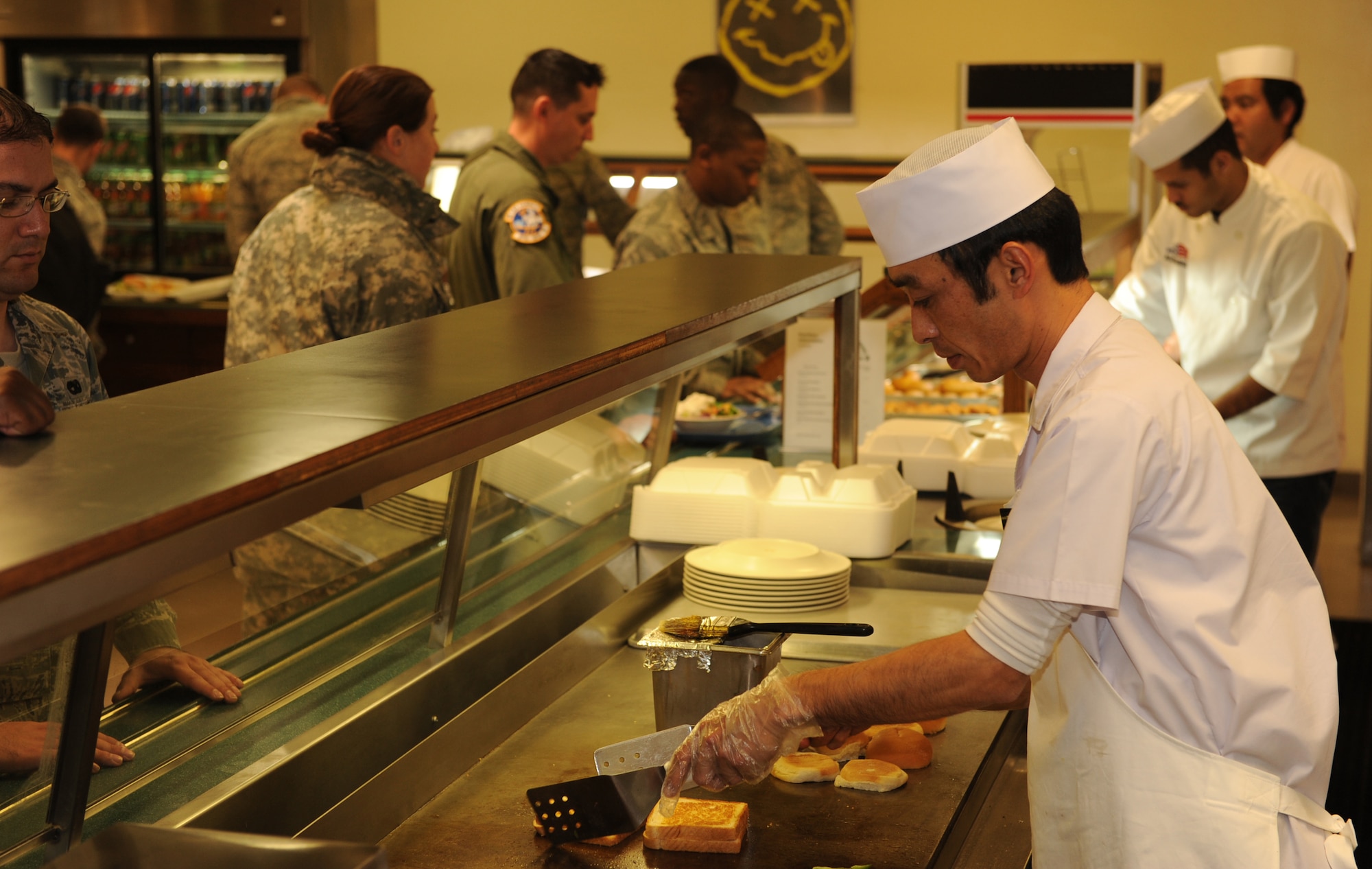 Members of the 18th Force Support Squadron prepare and serve lunch at the Marshall Dining Facility on Kadena Air Base, Japan, Feb. 1, 2012. The 18th FSS's food service team, along with other food operations across Kadena, won the Pacific Air Forces’ Food Operations Program of the Year for 2012. 18th FSS also won seven other PACAF awards. (U.S. Air Force photo by Airman 1st Class Justin S. Veazie)