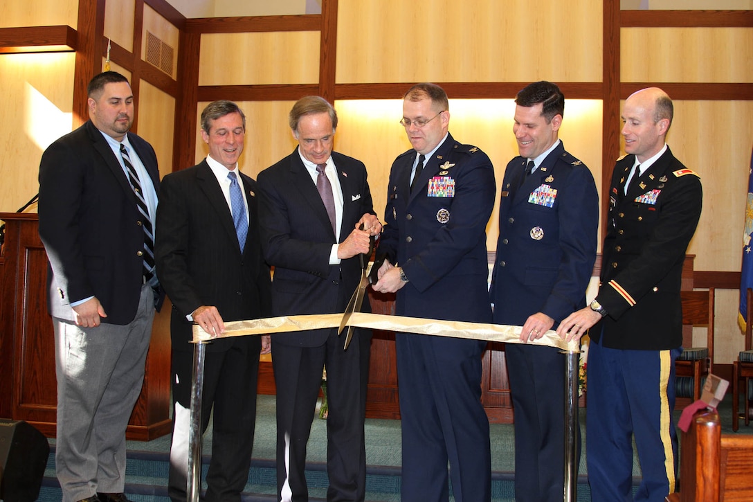 Philadelphia District Commander Lt. Col. Chris Becking (right) participates in the official ribbon cutting ceremony of the Chapel Center, along with Sen. Tom Carper (DE) and Rep. John Carney (DE-At large) and leadership from Dover Air Force Base.