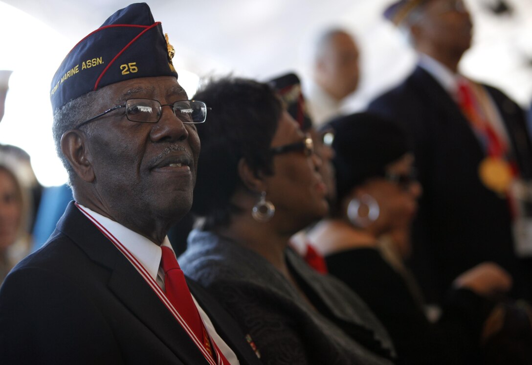 A Montford Point Association member watches opening remarks before the christening of the USNS Montford Point at General Dynamics NASSCO Shipyard, March 2.  The ship was named in honor of the black Marines who trained aboard Camp Montford Point, N.C., in the 1940s and served in supportive roles during World War II. They also saw combat in Korea.  Black Marines began integrating with their white counterparts in recruit training in 1949 at the two Marine Corps Recruit Depots.