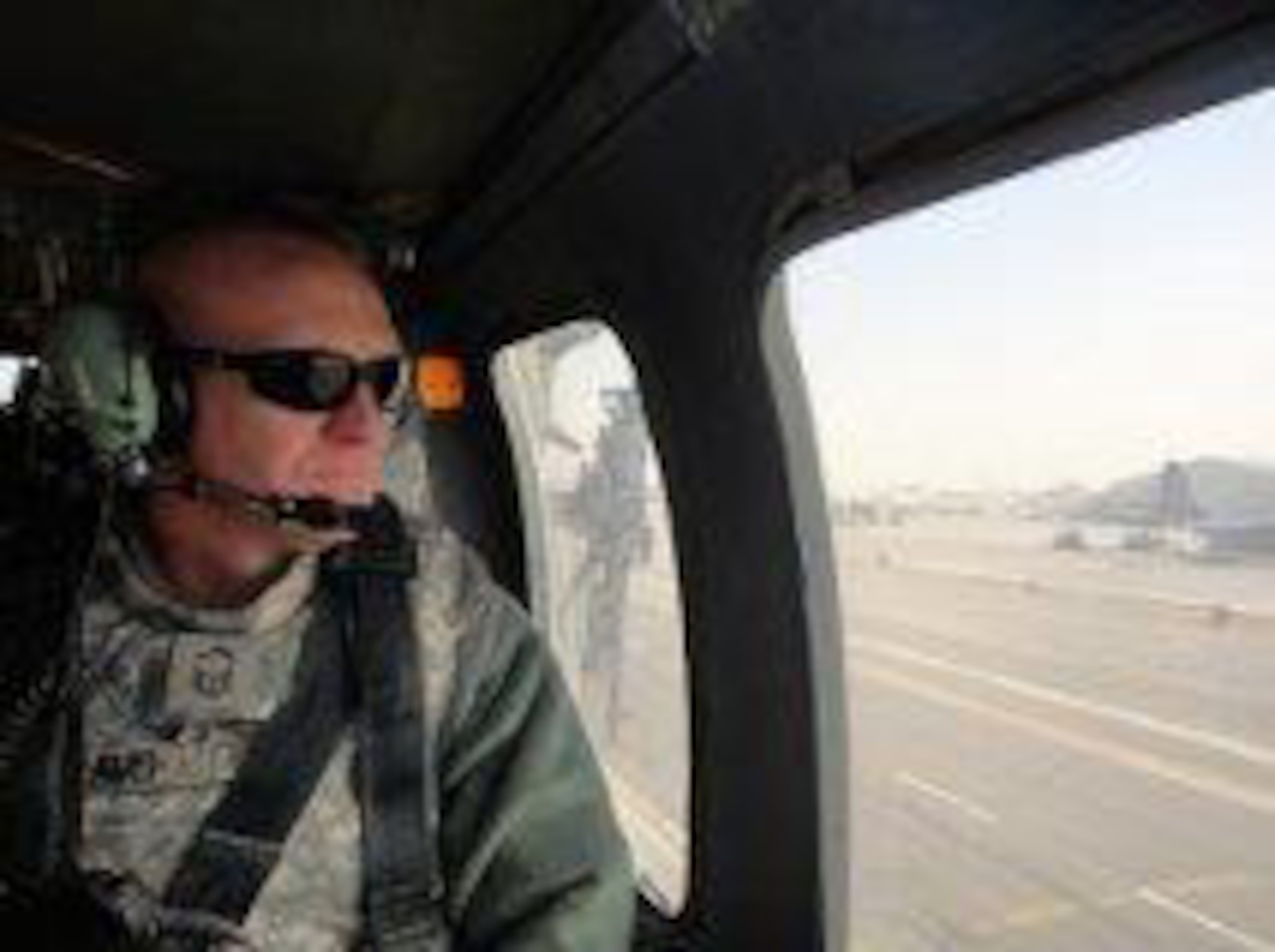 Senior Master Sgt. David Williams, 366th Security Forces Squadron operations superintendent, poses in a helicopter prior to a battlefield circulation, during his last deployment to Kandahar Airfield, Afghanistan. Williams was assigned as the 820th Base Defense Group security superintendent, where he streamlined International Security Assistance Force manpower requirements. He was also the battle captain managing joint force responses to indirect fire and improvised-explosive device attacks. (Courtesy photo)