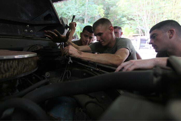 Marines with Combat Logistics Detachment 39, 3rd Marine Logistics Group, restore vintage Marine Corps vehicles on Feb. 27 at the Pacific War Museum. The Marines were restoring the vehicles as training during exercise Guahan Shield, an exercise designed to facilitate multiservice engagement and provide potential rapid response to theater crises and contingency operations in the Asia-Pacific region.


