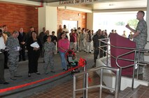 U.S. Air Force Col. Gary Schneider, 18th Civil Engineer Group commander, gives his opening remarks at a ribbon cutting ceremony during an open house for housing Tower 4506 on Camp Courtney, Japan, Feb. 21, 2013. The event was held to celebrate the re-opening of a housing tower on the camp. The tower was the first of six to be renovated and is for accompanied E1-E6 assigned to the northern area of Camp Courtney, Camp McTureous, Camp Hansen, Camp Schwab and White Beach. (U.S. Air Force photo/Airman 1st Class Keith James)