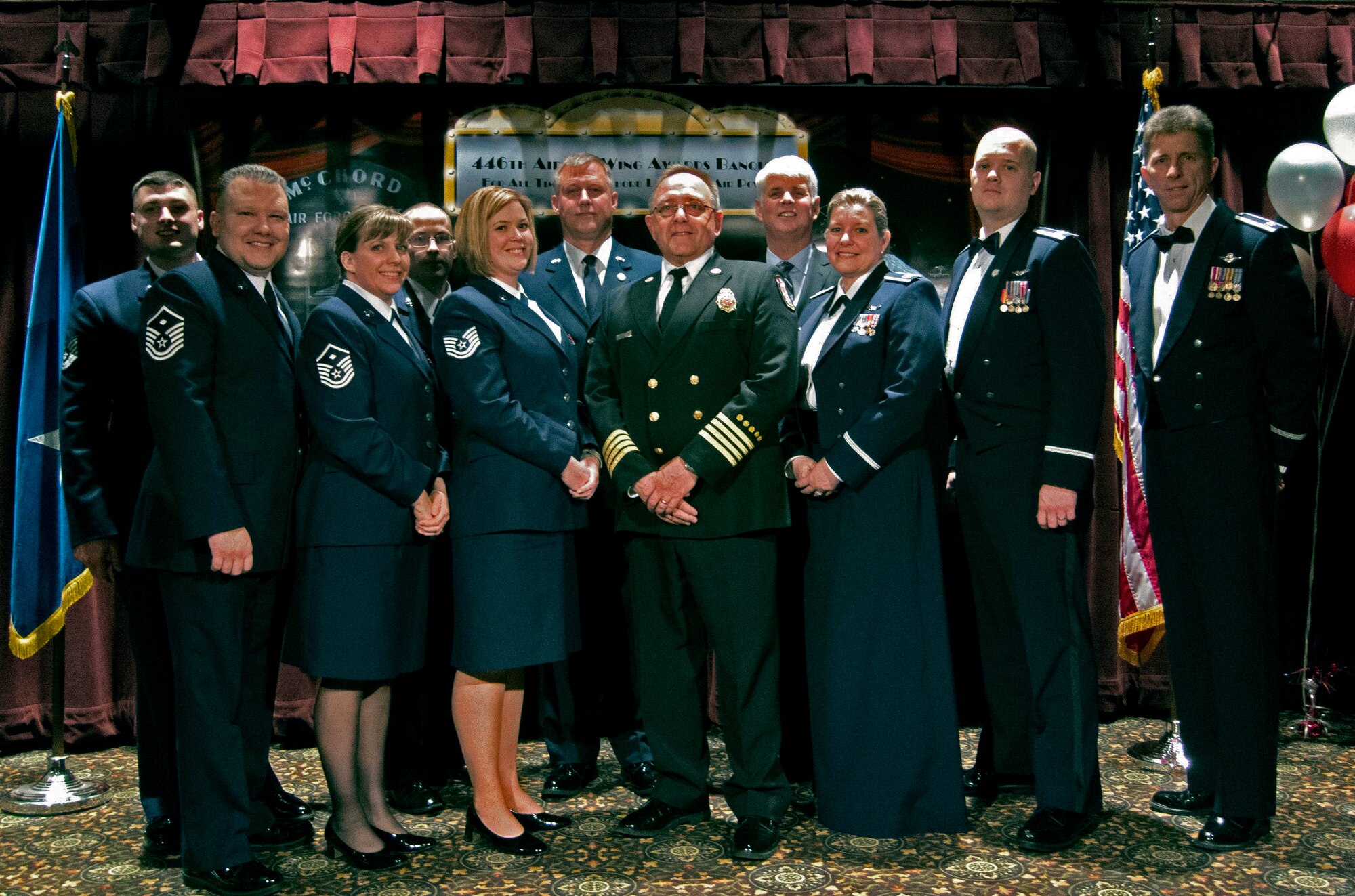 The "of the year" award recipients pose for photographs after the 446th Airlift Wing Annual Awards Banquet at the McChord Colocated Club here March 2. The group represents the greatest accomplishments for the wing over the past year. (Courtesy photo)
