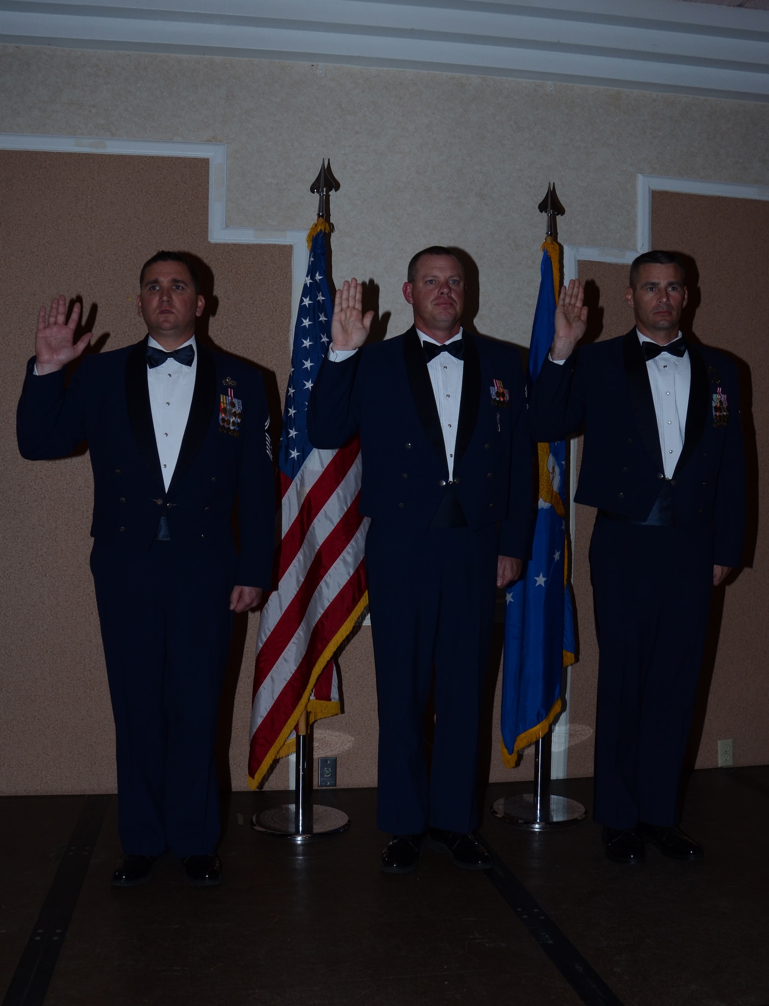 One newly-pinned chief master sergeant and two chief selects take the Chief's Oath during the Chief's Recognition Ceremony March 2, 2012, in Cocoa Beach, Fla. The chief and chief selects were the events honorees and are all assigned to Patrick Air Force Base, Fla. (U.S. Air Force photo/Senior Airman Natasha Dowridge)
