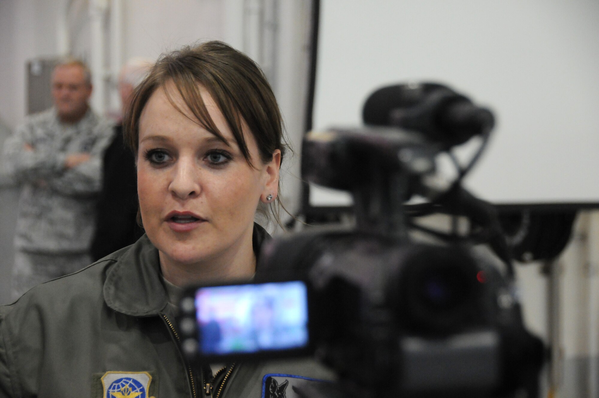 Staff Sgt. Melissa Wulf, with the 185th Air Refueling Wing (ARW), speaks with media during a welcome home ceremony.  Members of the 185th ARW were honored in a welcome home ceremony for deploying overseas, at the 185th base in, Sioux City, Iowa, March 3, 2013. (U.S. Air Force Photo by tech. Sgt. Oscar Sanchez / Released)