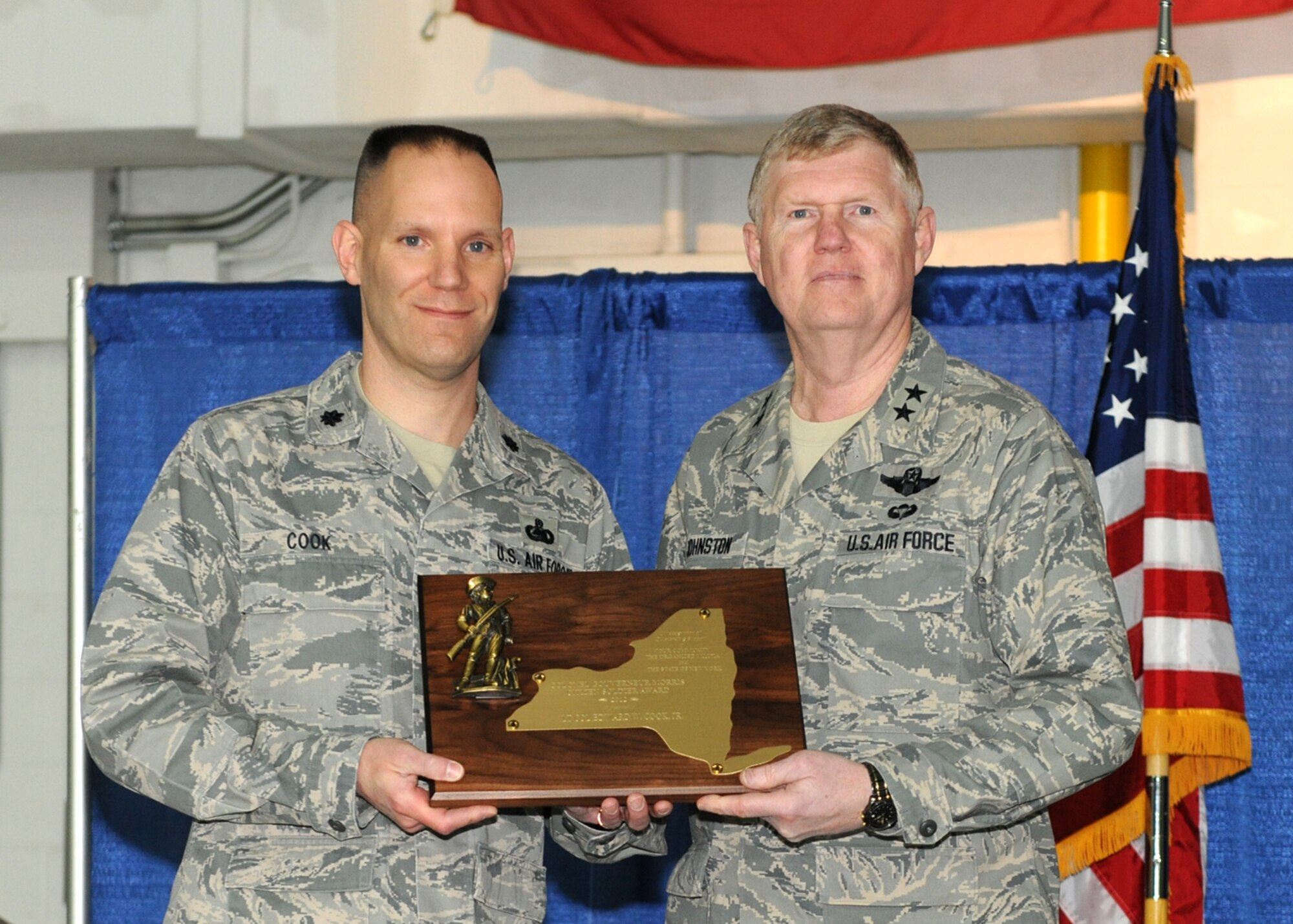 New York Air National Guard Commander Maj. Gen. Verle L. Johnston (right) presents Lt. Col. Edward W. Cook, 174th Attack Wing Logistics Readiness Squadron Commander, with the Colonel Governour Morris Citizen Soldier Award at Hancock Field, Syracuse NY on 3 March 2013. The award is presented annually to a member of the New York State Organized Militia who has distinguished himself through outstanding support to the New York National Guard and his local community. (NYANG photo by Tech. Sgt. Justin Huett/Released)
