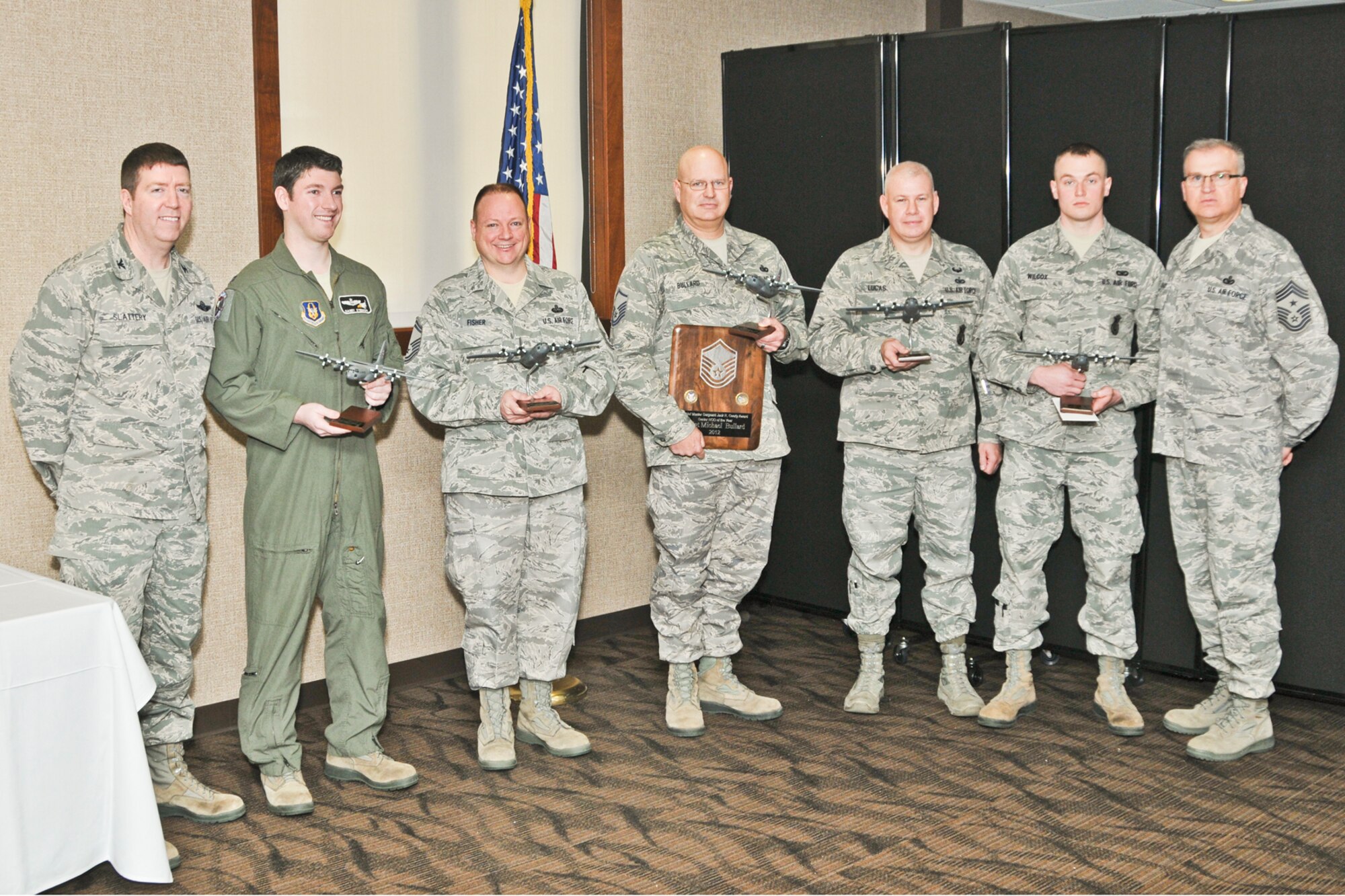 YOUNGSTOWN AIR RESERVE STATION, Ohio -- U.S. Air Force Reserve Col. Patrick Slattery, vice commander of 910th Airlift Wing here, and Chief Master Sgt. Troy Rhoades, command chief of 910th AW, pose with the 2012 "Of the Year" award winners March 3, 2013 following an award ceremony at the Community Activity Center here. U.S. Air Force photo by Senior Airman Ron Dombkowski 