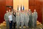 The keynote speaker at the Utah Air National Guard's Women's History Month celebration, Col. Christine Burckle, poses with some audience members after her presentation on base, March 3. In her presentation, Burckle highlighted women's roles throughout military history and offered advice to women who currently serve. (U.S. Air Force photo by TSgt. Jeremy Giacoletto-Stegall)(RELEASED)