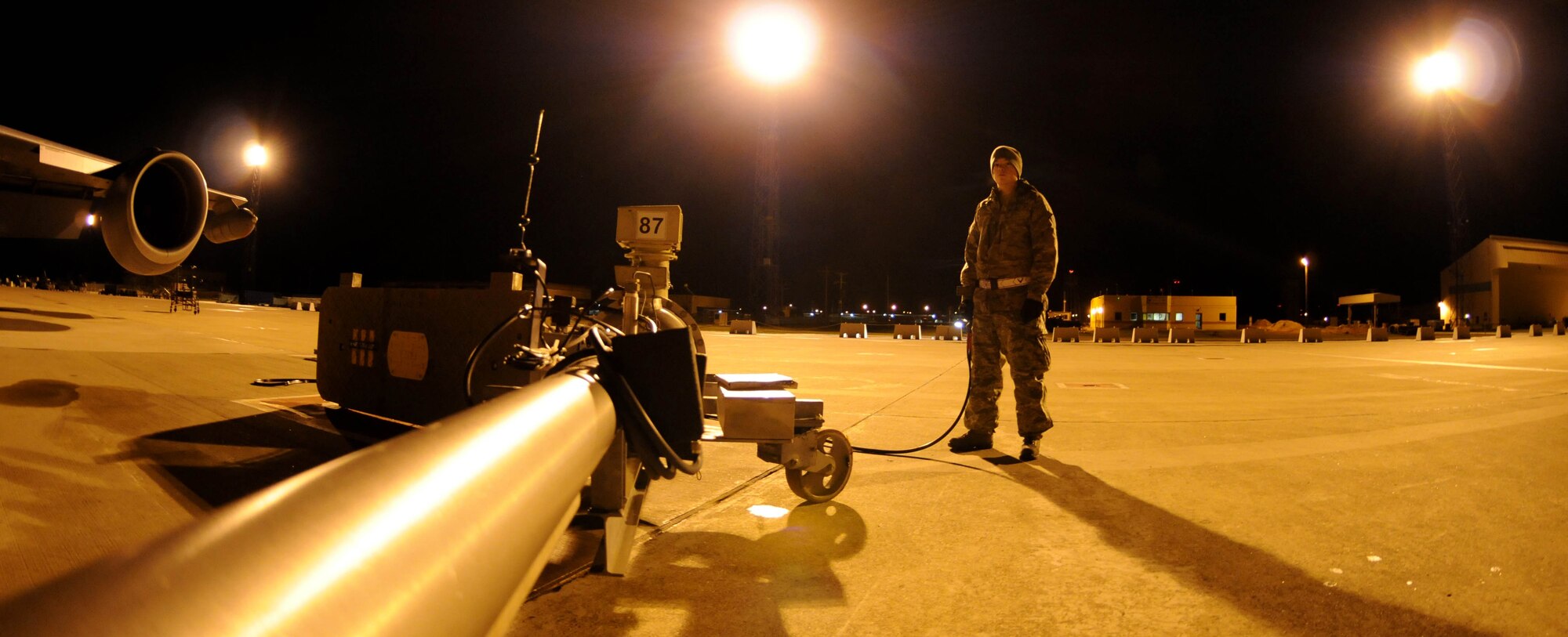 Senior Airman Dillon Moore, 100th Logistics Readiness Squadron fuels technician, monitors the refueling of a KC-135 Stratotanker Feb. 28, 2013. Moore, from Reno, Nev., is deployed to southwest Europe in support of French operations in Mali. KC-135 aircrews from the 100th Air Refueling Wing, RAF Mildenhall, England, have been flying aerial refueling sorties from the deployed location since January. (U.S. Air Force photo/Staff Sgt. Austin M. May)
