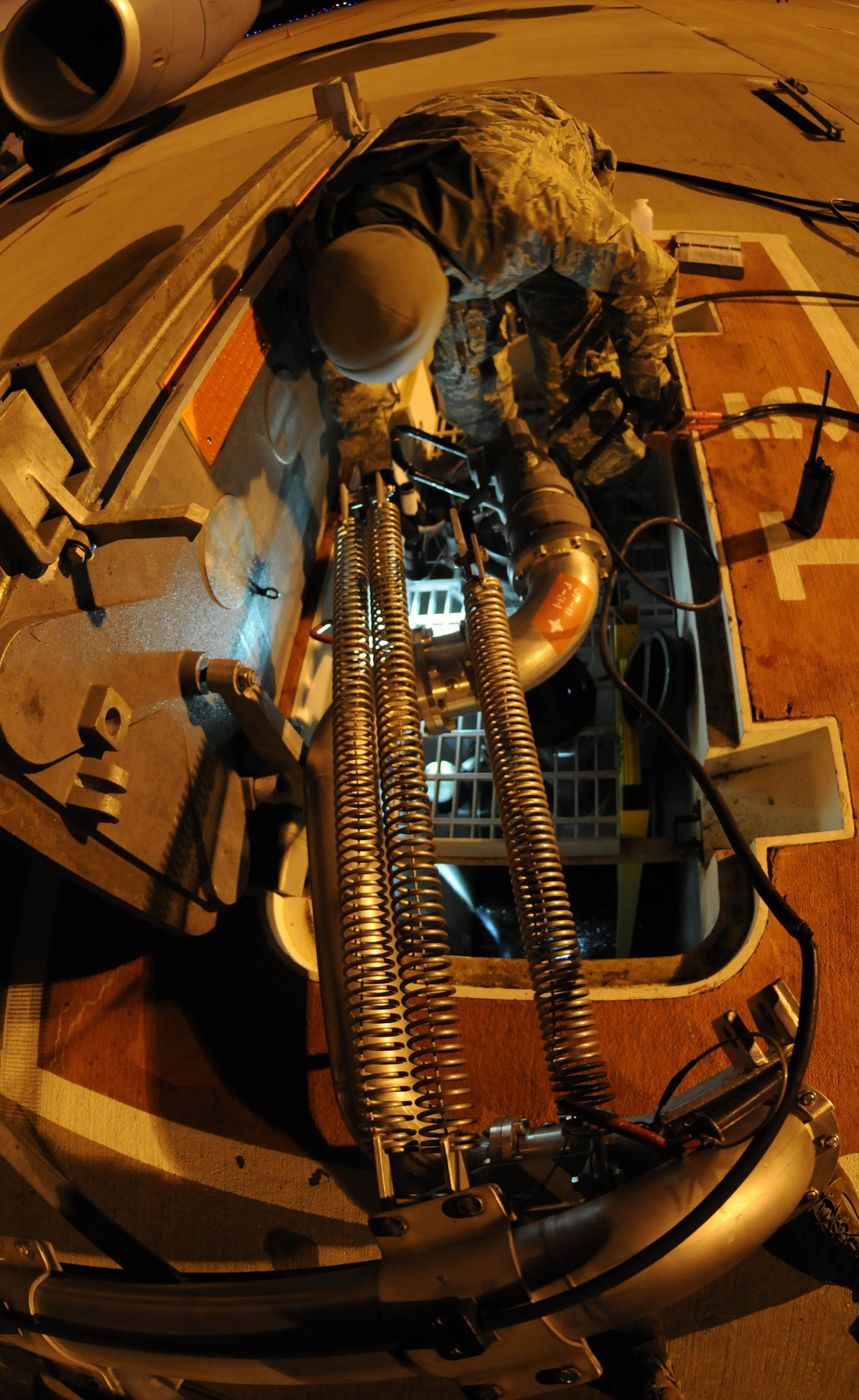 Senior Airman Dillon Moore, 100th Logistics Readiness Squadron fuels technician, inspects an in-ground fuel pump before fueling a KC-135 Stratotanker Feb. 28, 2013. Moore, from Reno, Nev., is deployed to southwest Europe in support of French operations in Mali. KC-135 aircrews from the 100th Air Refueling Wing, RAF Mildenhall, England, have been flying aerial refueling sorties from the deployed location since January. (U.S. Air Force photo/Staff Sgt. Austin M. May)