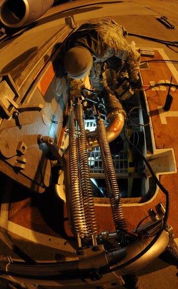 Senior Airman Dillon Moore, 100th Logistics Readiness Squadron fuels technician, inspects an in-ground fuel pump before fueling a KC-135 Stratotanker Feb. 28, 2013. Moore, from Reno, Nev., is deployed to southwest Europe in support of French operations in Mali. KC-135 aircrews from the 100th Air Refueling Wing, RAF Mildenhall, England, have been flying aerial refueling sorties from the deployed location since January. (U.S. Air Force photo/Staff Sgt. Austin M. May)