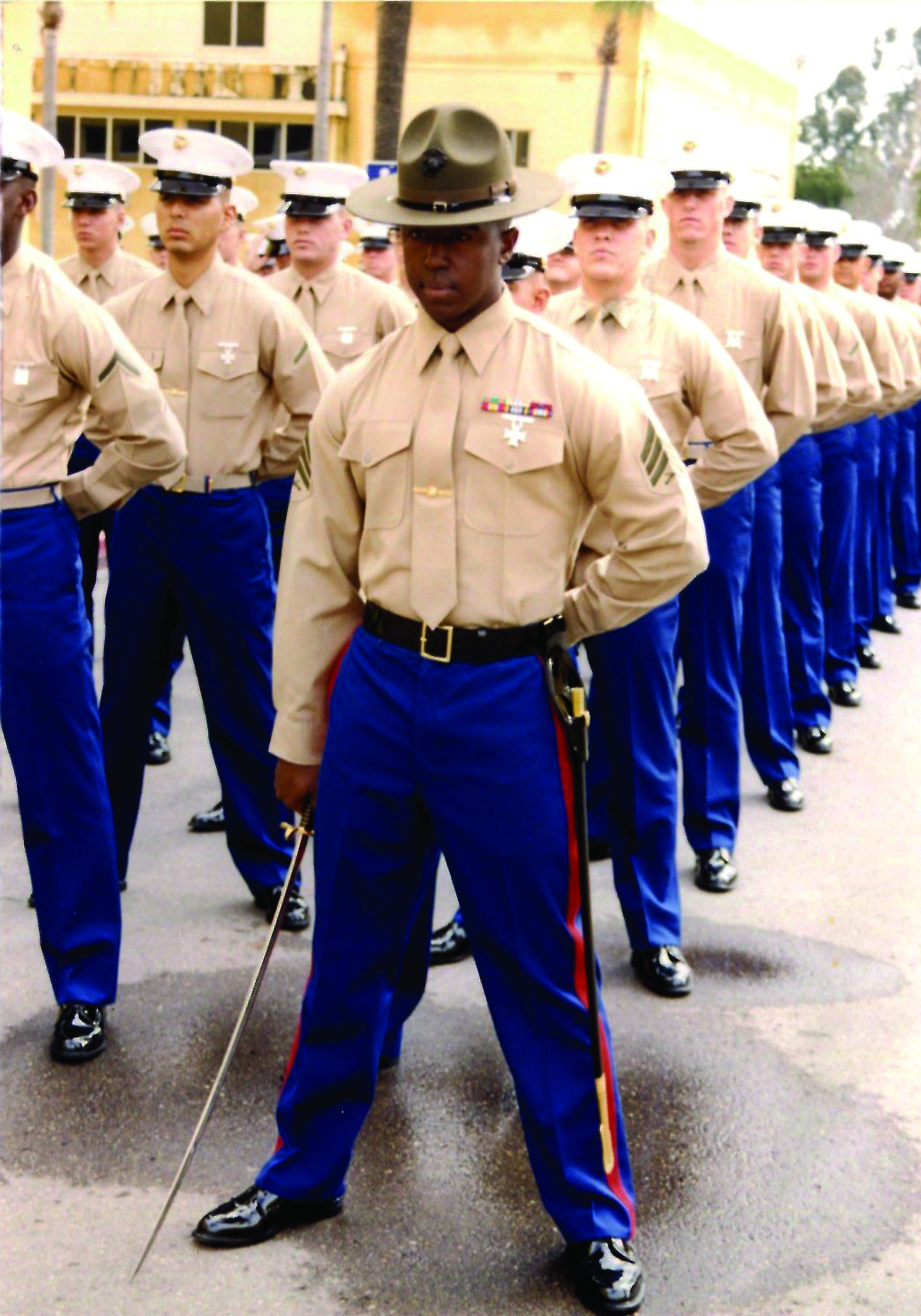 Sergeant Lorenzo Lacy leads his platoon as a senior drill instructor on Marine Corps Recruit Depot, San Diego. Lacy picked up staff sergeant meritoriously on the drill field. 
