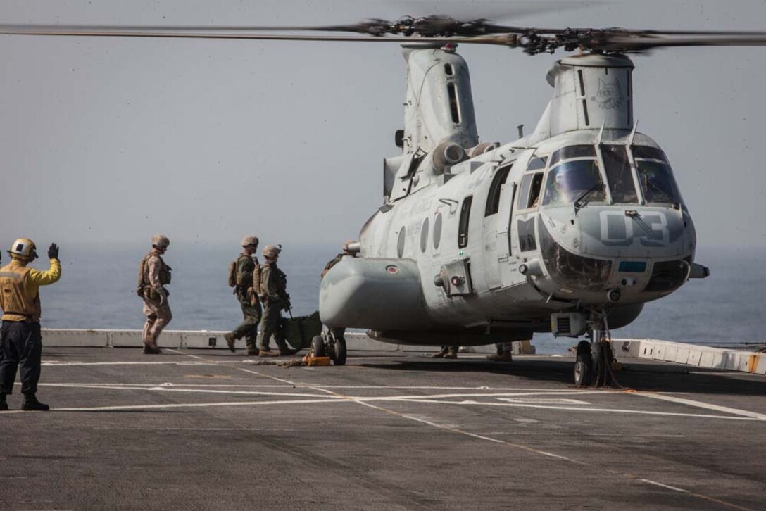 Marines with the 15th Marine Expeditionary Unit load into a CH-46E Sea Knight with Marine Medium Helicopter Squadron 364 (Rein.), 15th MEU, to participate in fast-rope training aboard the USS Green Bay, Feb. 26. The 15th MEU is deployed as part of the Peleliu Amphibious Ready Group as a U.S. Central Command theater reserve force, providing support for maritime security operations and theater security cooperation efforts in the U.S. 5th Fleet area of responsibility. (U.S. Marine Corps photo by Cpl. Bobby J. Gonzalez/Released)