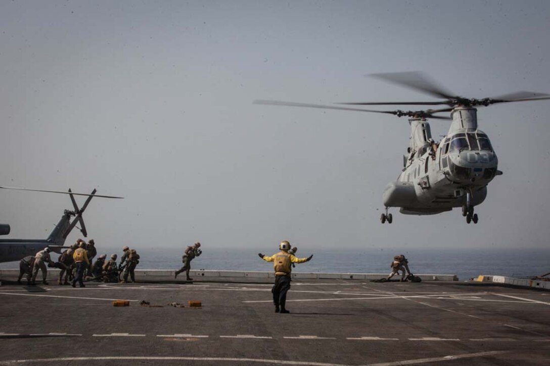 A CH-46E Sea Knight with Marine Medium Helicopter Squadron 364 (Rein.), 15th Marine Expeditionary Unit, hovers over the flight deck of the USS Green Bay before conduct fast-rope training, Feb. 26. The 15th MEU is deployed as part of the Peleliu Amphibious Ready Group as a U.S. Central Command theater reserve force, providing support for maritime security operations and theater security cooperation efforts in the U.S. 5th Fleet area of responsibility. (U.S. Marine Corps photo by Cpl. Bobby J. Gonzalez/Released)