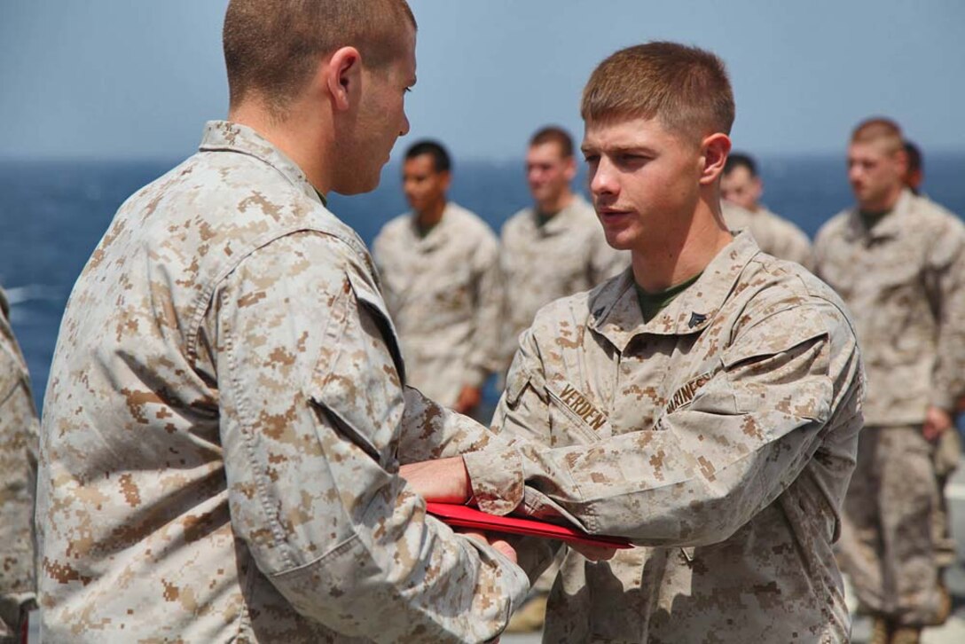 Corporal Christopher Verden, motor transportation mechanic, 1st Platoon, Battery B, Battalion Landing Team 3/5, 15th Marine Expeditionary Unit, is promoted to the rank of corporal aboard USS Rushmore, March 1. The 15th MEU is deployed as part of the Peleliu Amphibious Ready Group as a U.S. Central Command theater reserve force, providing support for maritime security operations and theater security cooperation efforts in the U.S. 5th Fleet area of responsibility. (U.S. Marine Corps photo by Cpl. Timothy R. Childers/ Released)