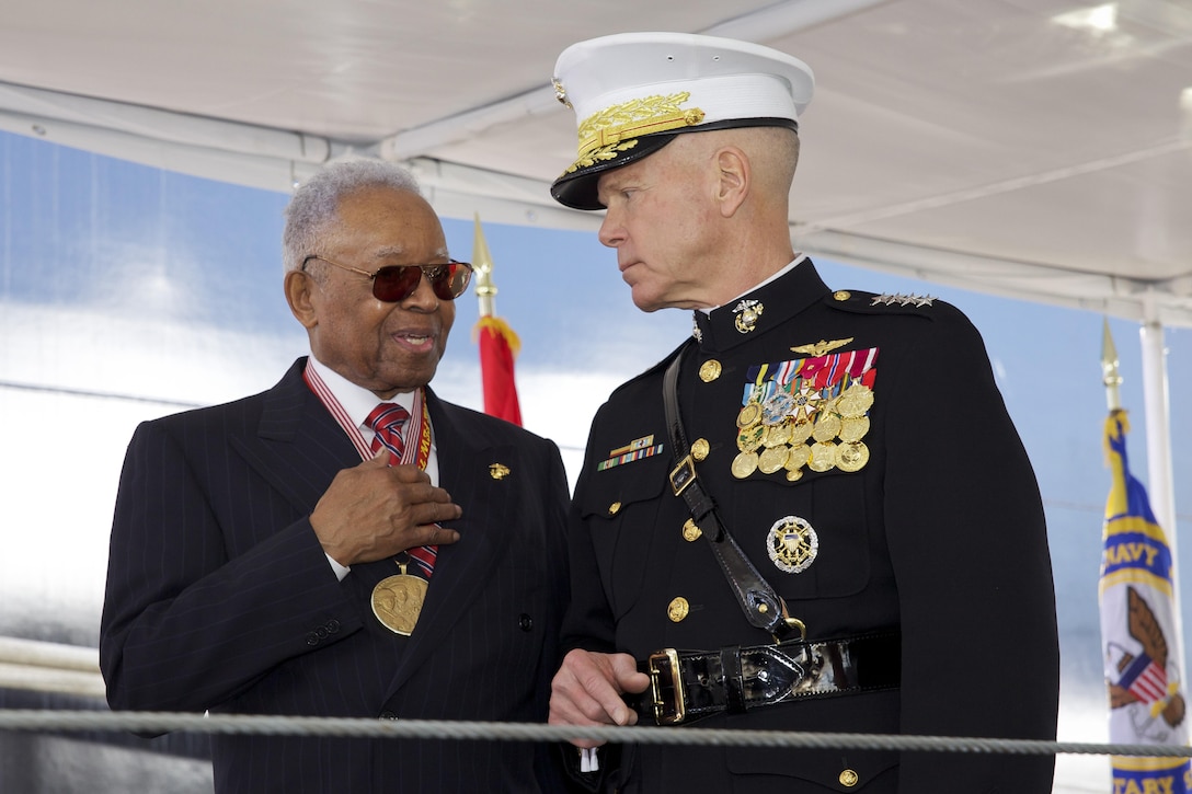 The 35th commandant of the Marine Corps, General James F. Amos, greets guests at the United States Naval Ship Montford Point Christening Ceremony at General Dynamics NASSCO in San Diego, Ca, March. 2, 2013. (U.S. Marine Corps photo by Sgt. Mallory S. VanderSchans)(RELEASED)
