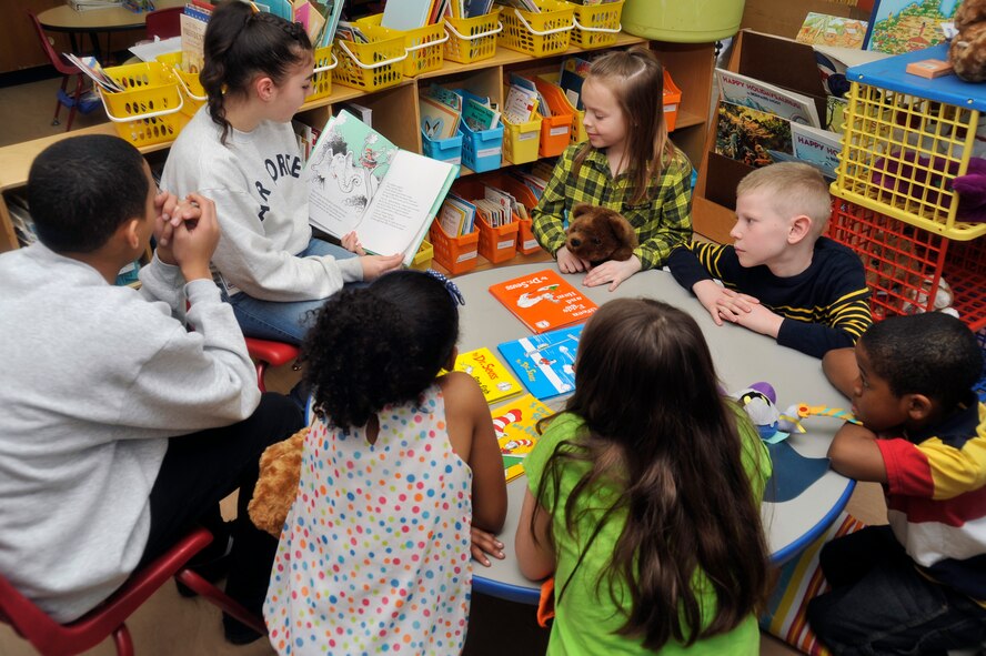 Edgren High School students read to Cummings Elementary School second-graders at Misawa Air Base, Japan, Feb. 28, 2013. More than 25 members of Edgren’s Junior ROTC program came to Cummings to read for students during Read Across America Week. (U.S. Air Force photo by Airman 1st Class Zachary Kee)