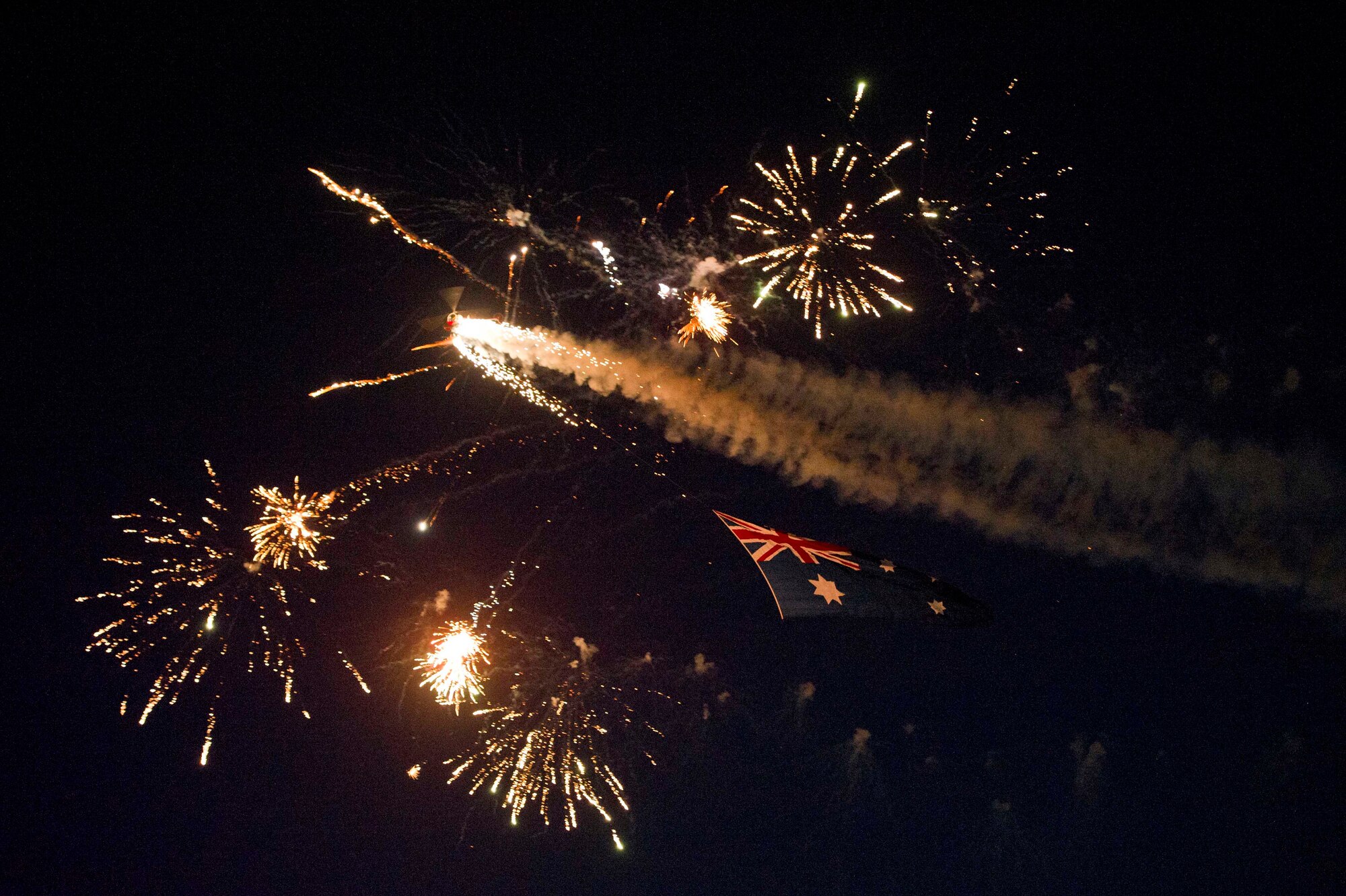 Otto the helicopter displays a 50-foot Australian Flag during a night performance at the Australian International Airshow, March 1, 2013 at Avalon Airport in Geelong, Australia. Approximately 220 U.S. service members along with the U.S. Air Force's F-22 Raptor, C-17 Globemaster III, F-16 Fighting Falcon, B-52 Stratofortress, and KC-135 Stratotanker are supporting the Australian International Airshow 2013, which allows a unique opportunity for the United States to showcase its aviation prowess and strengthen military-to-military ties with our Pacific allies and partners. (Department of Defense photo by U.S. Air Force Tech. Sgt. Michael R. Holzworth/Released)