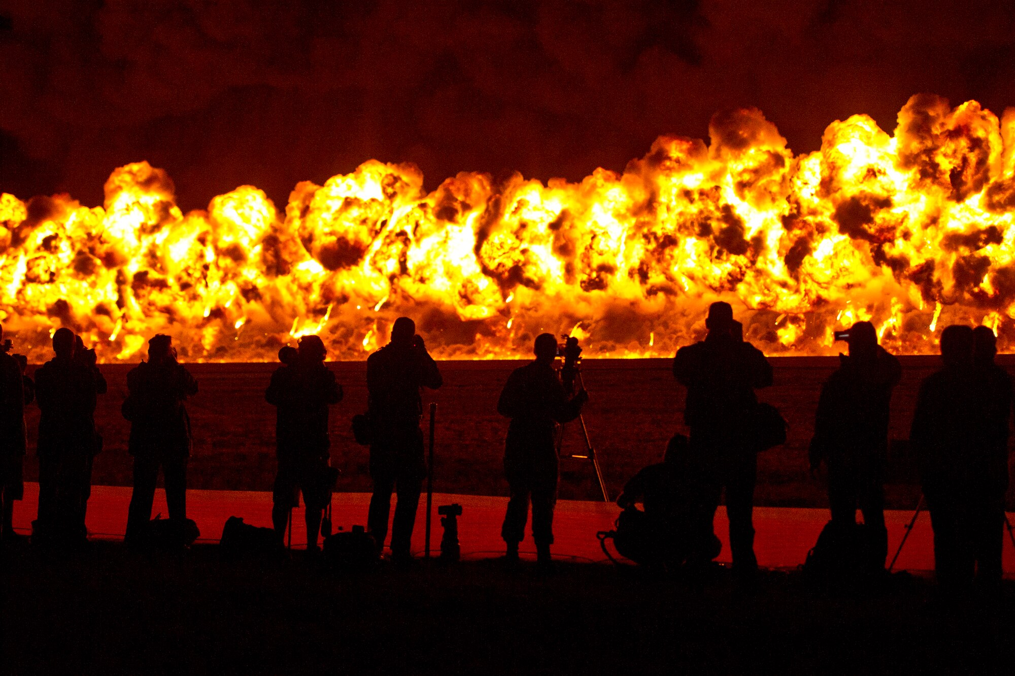 International Media look on as pyrotechniques show dazzles a crowd of 180,000 spectators marking the end of the first day at Australian International Airshow, March 1, 2013 at Avalon Airport in Geelong, Australia. Approximately 220 U.S. service members along with the U.S. Air Force's F-22 Raptor, C-17 Globemaster III, F-16 Fighting Falcon, B-52 Stratofortress, and KC-135 Stratotanker are supporting the Australian International Airshow 2013, which allows a unique opportunity for the United States to showcase its aviation prowess and strengthen military-to-military ties with our Pacific allies and partners. (Department of Defense photo by U.S. Air Force Tech. Sgt. Michael R. Holzworth/Released)